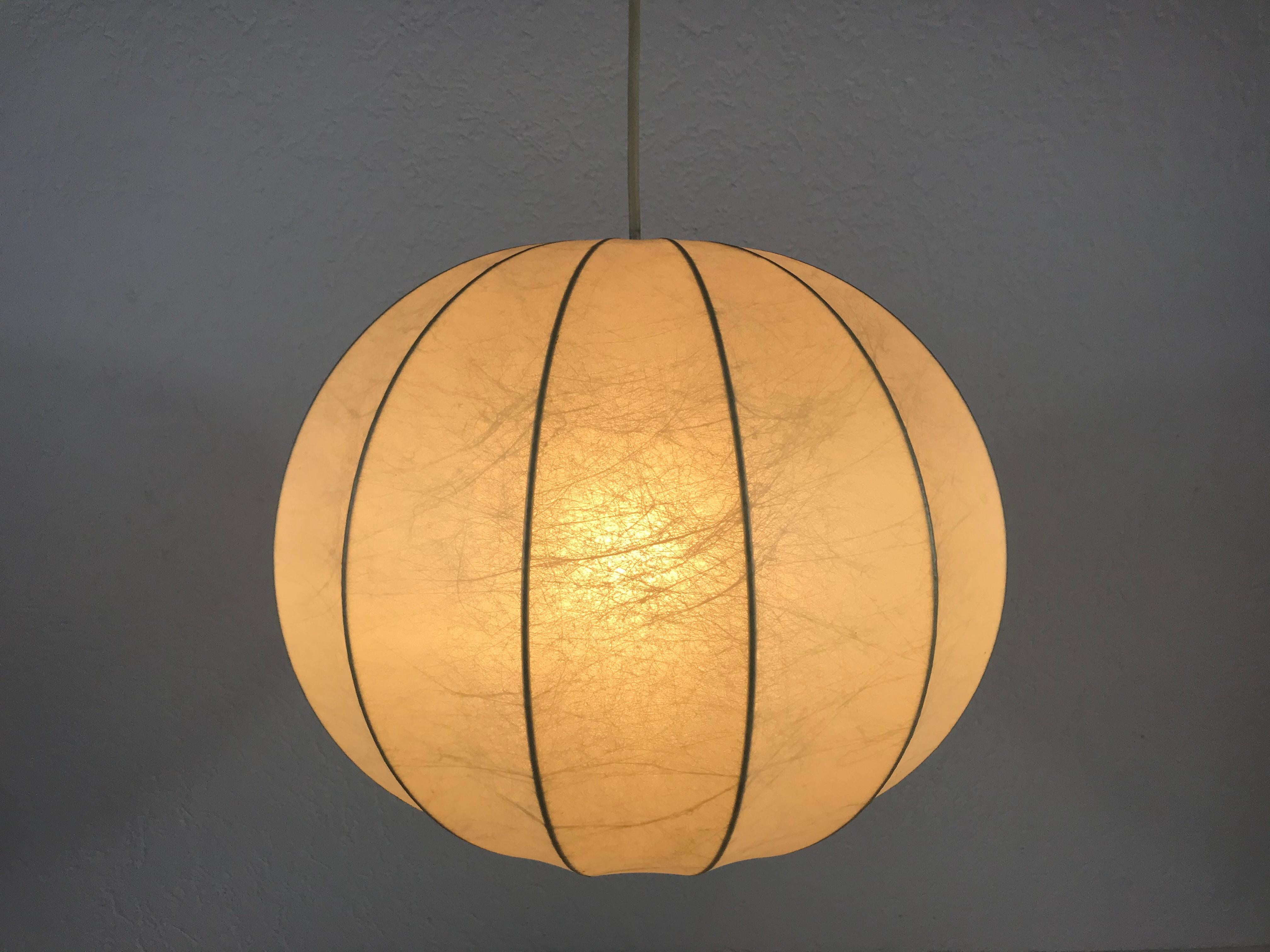 A cocoon hanging lamp made in Italy in the 1960s. It has a beautiful round design, which is similar to the lamps made by Castiglioni. 


The light requires one E27 light bulb.