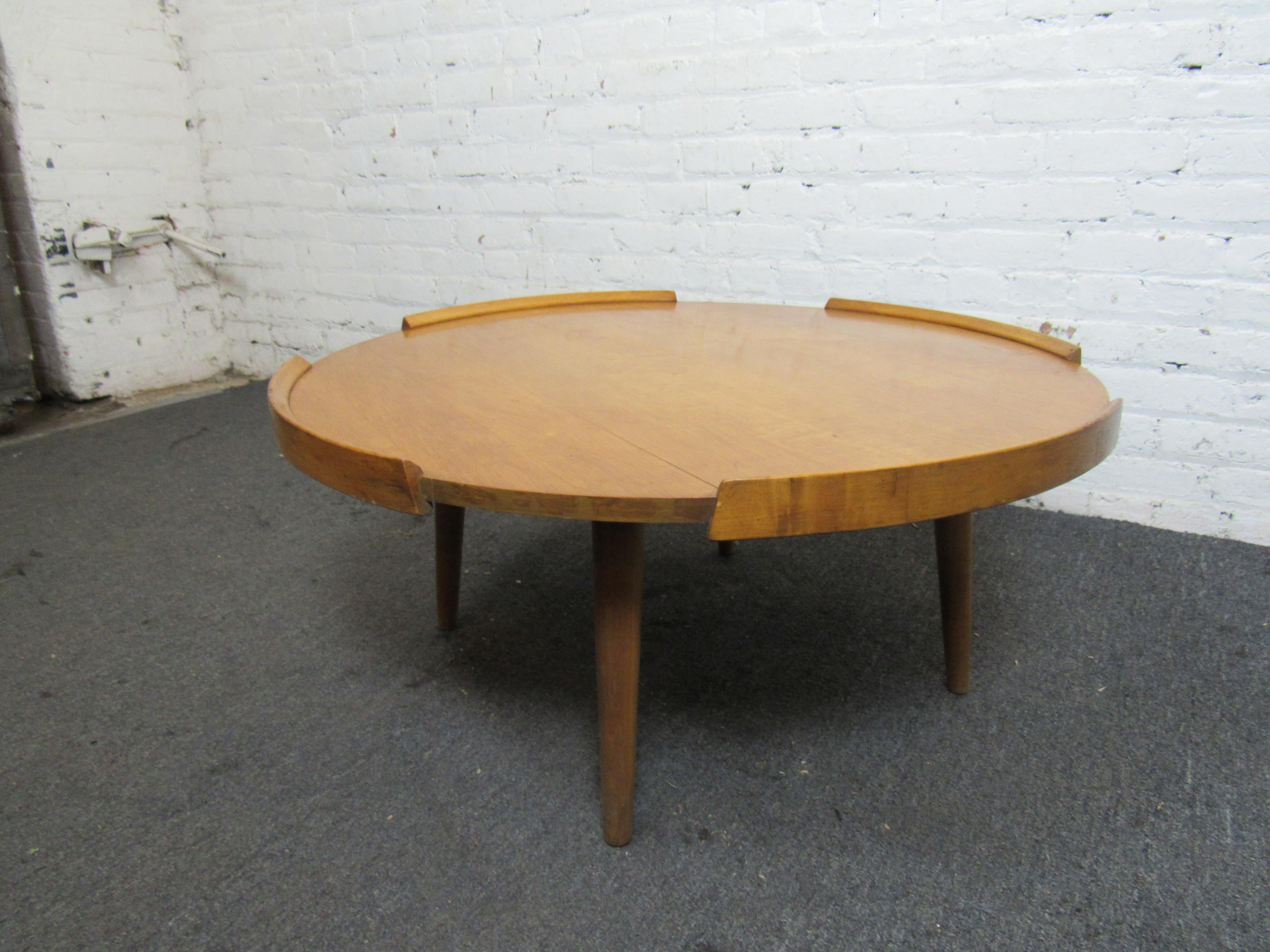 Unique mid-century coffee table with side flares. Built from beautiful maple wood which is less common for century pieces. 
(Please confirm item location - NY or NJ - with dealer).
 
