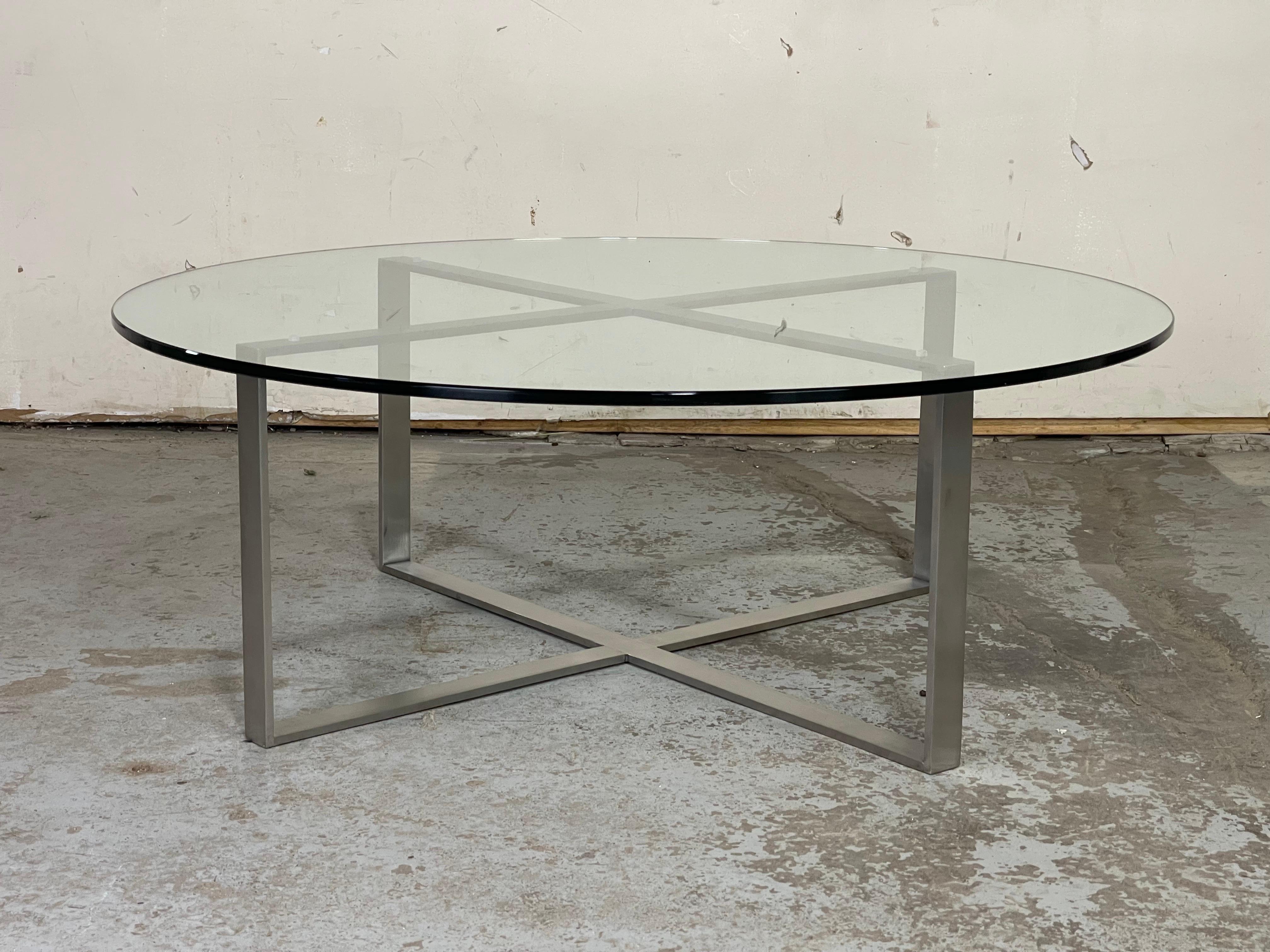 Very well made brushed stainless steel and glass coffee table by Bernhardt. The stainless steel is very heavy and amazingly one solid piece. The glass is in great shape with very minimal wear and thick. Same weight and quality as Knoll. 
41.75