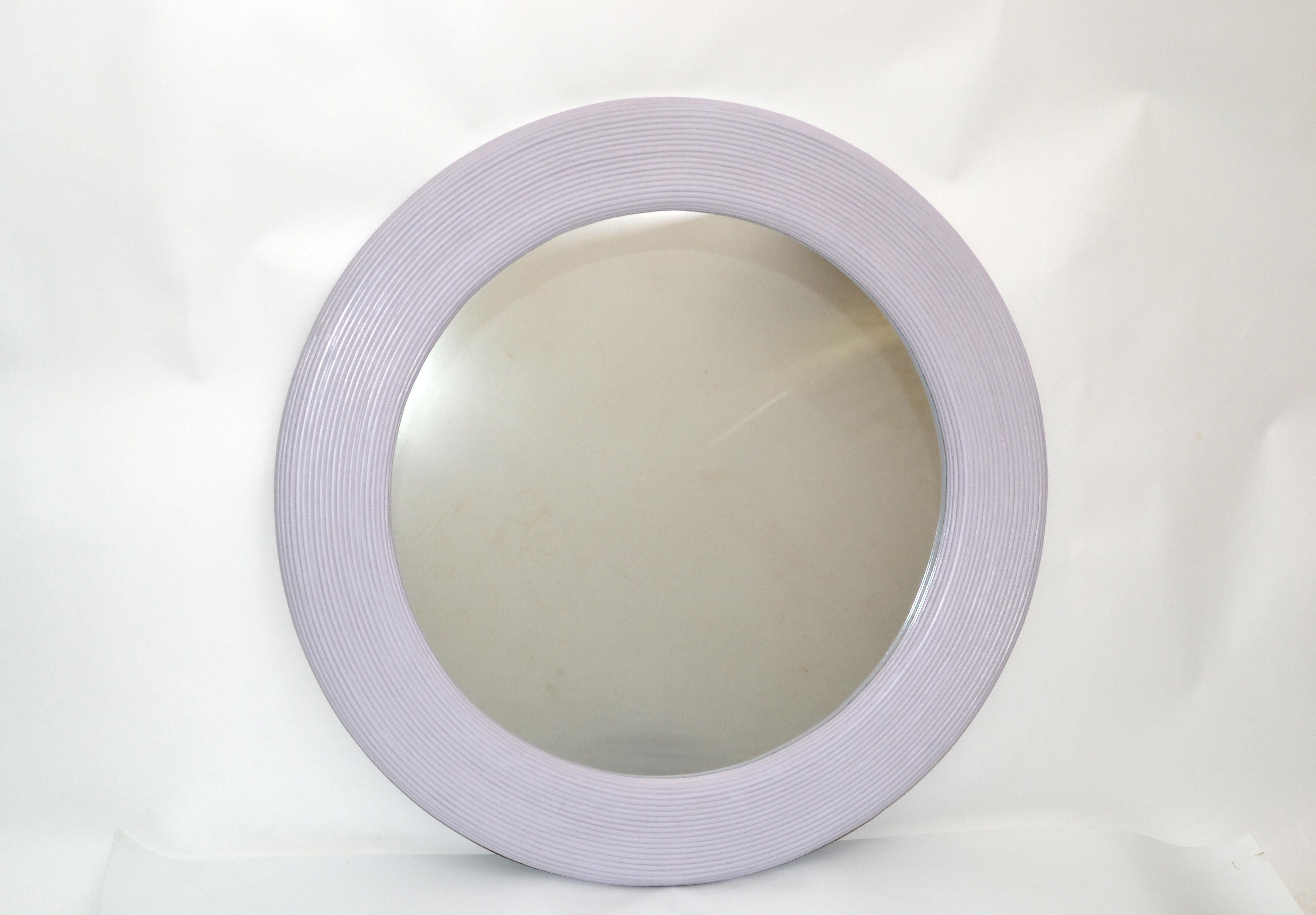 Mid-Century Modern round handmade in light purple finish pencil reed wall mirror.
The mirror is woven with pencil reed and has wooden backing.
Great for the sunroom.