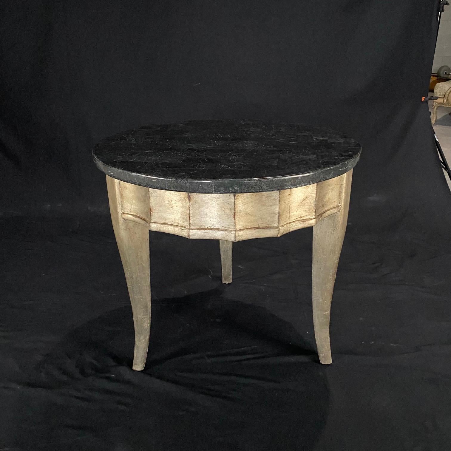 Really lovely and versatile Mid-Century Modern round side table having a silver leaf base and deep green marble top. Beautiful sculpted sides over tapered legs. 
Measure: H of skirt 21.5
#2819.