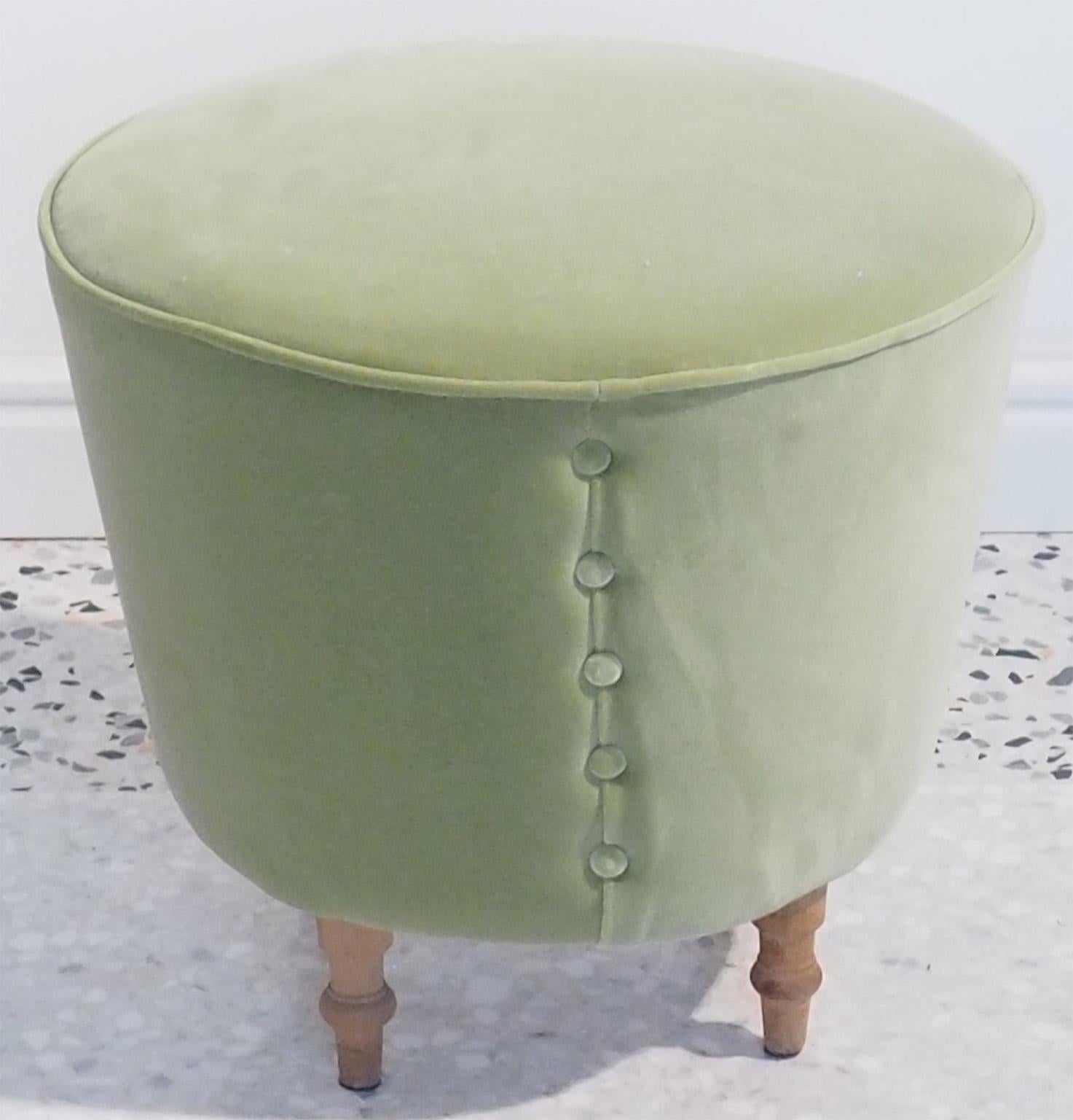 Round stool in Verde Acqua velvet finished with decorative row of buttons and with wood legs.
Rehupolstered with Verde Acqua Italian pure cotton velvet.