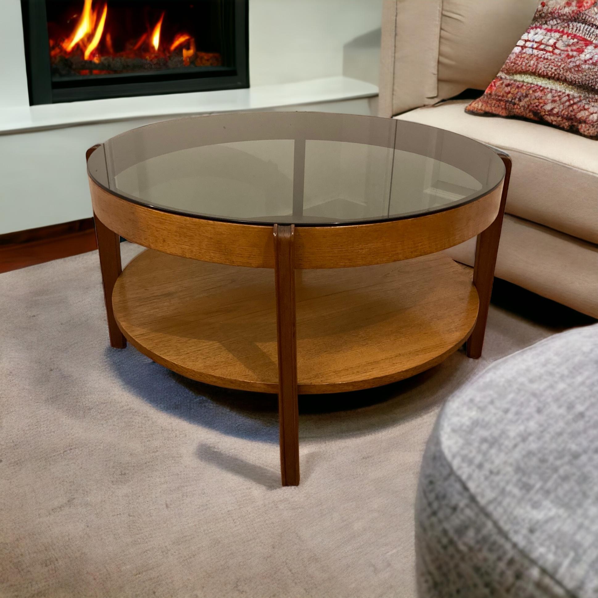 British Mid Century Modern round Teak Coffee Table, smoked glass by Remploy of England.