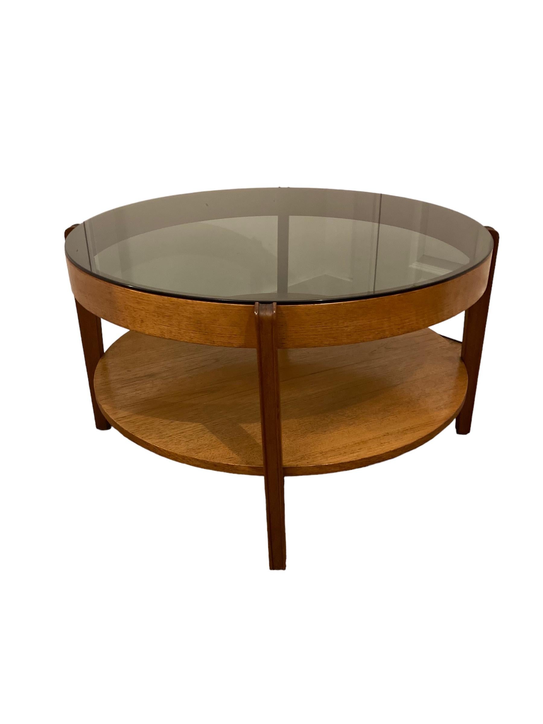 Glass Mid Century Modern round Teak Coffee Table, smoked glass by Remploy of England.