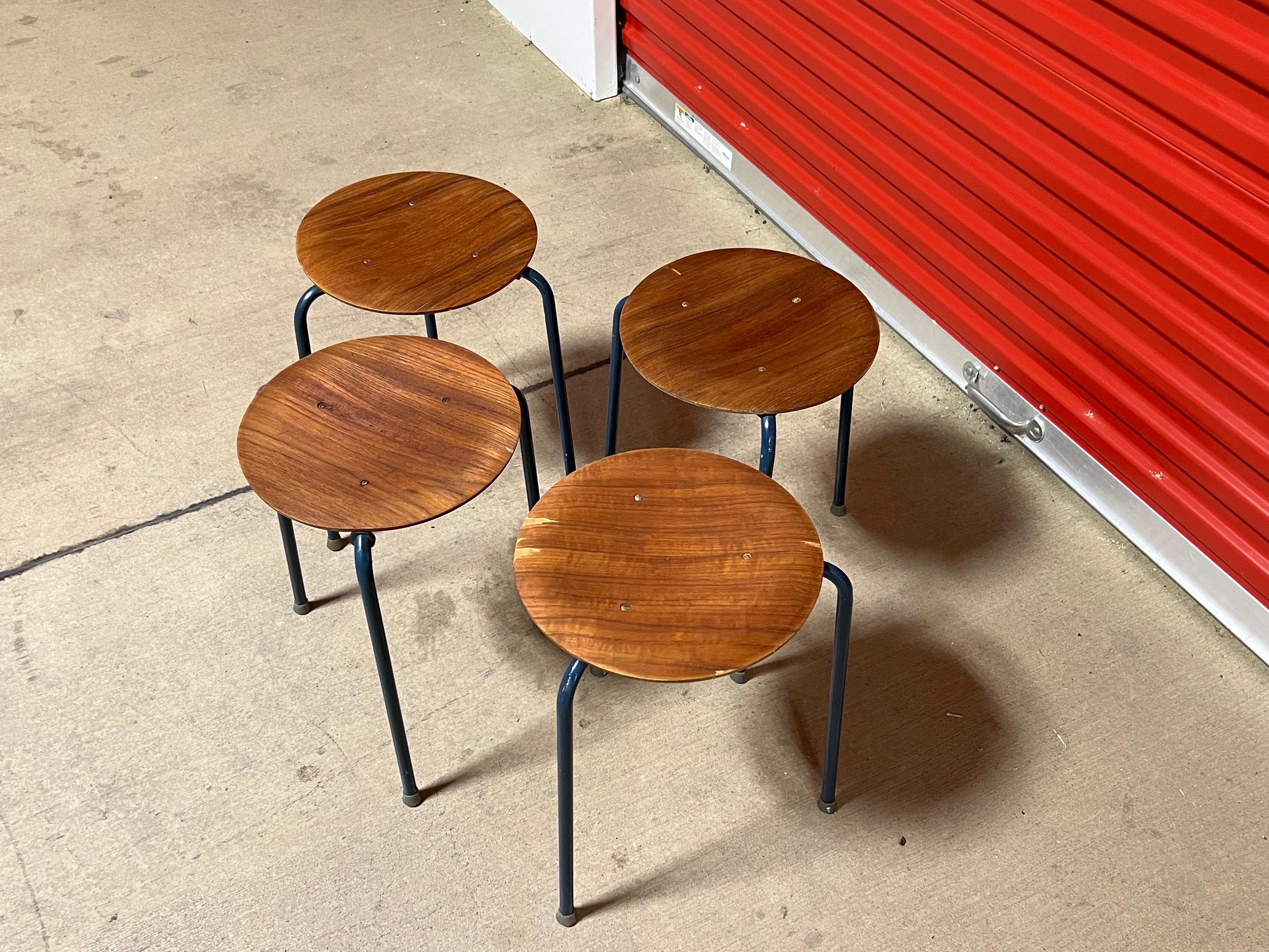 For sale is this nice vintage set of stools / side tables. The tables have a teak veneer top with metal legs, and the stands are stamped underneath made in Denmark