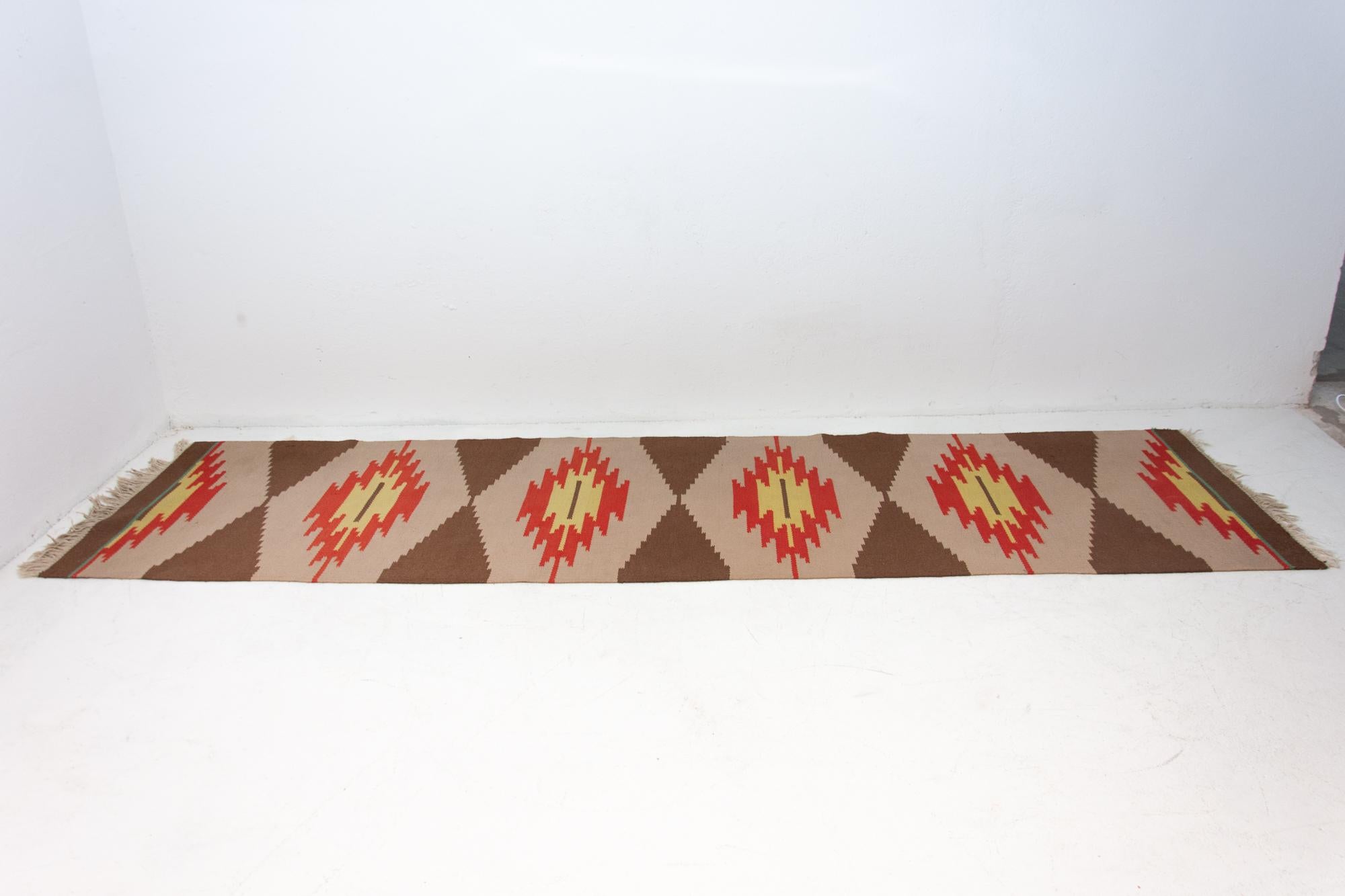 Mid-Century Modern rug Kelim. Made in the 1960s. It's associated with EXPO 58, handmade work, simple design.

Signs of age and using, slight abrasions at one point, the rug fringe are not complete, but overall in good Vintage condition.