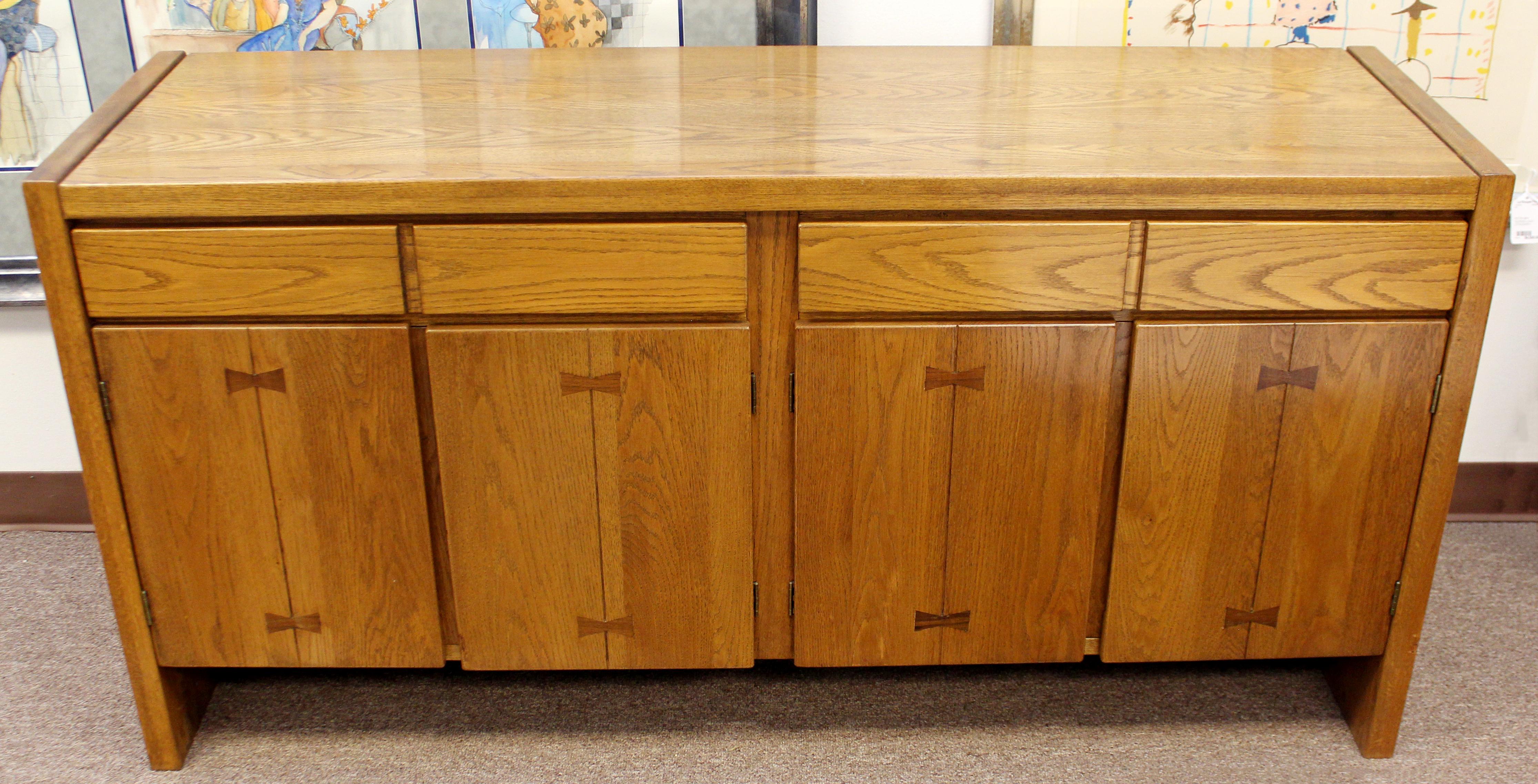 For your consideration is a wonderful, wood credenza, with two shelves and two drawers, by Russel Wright for Conant Ball, circa 1950s. In excellent vintage condition. The dimensions are 60