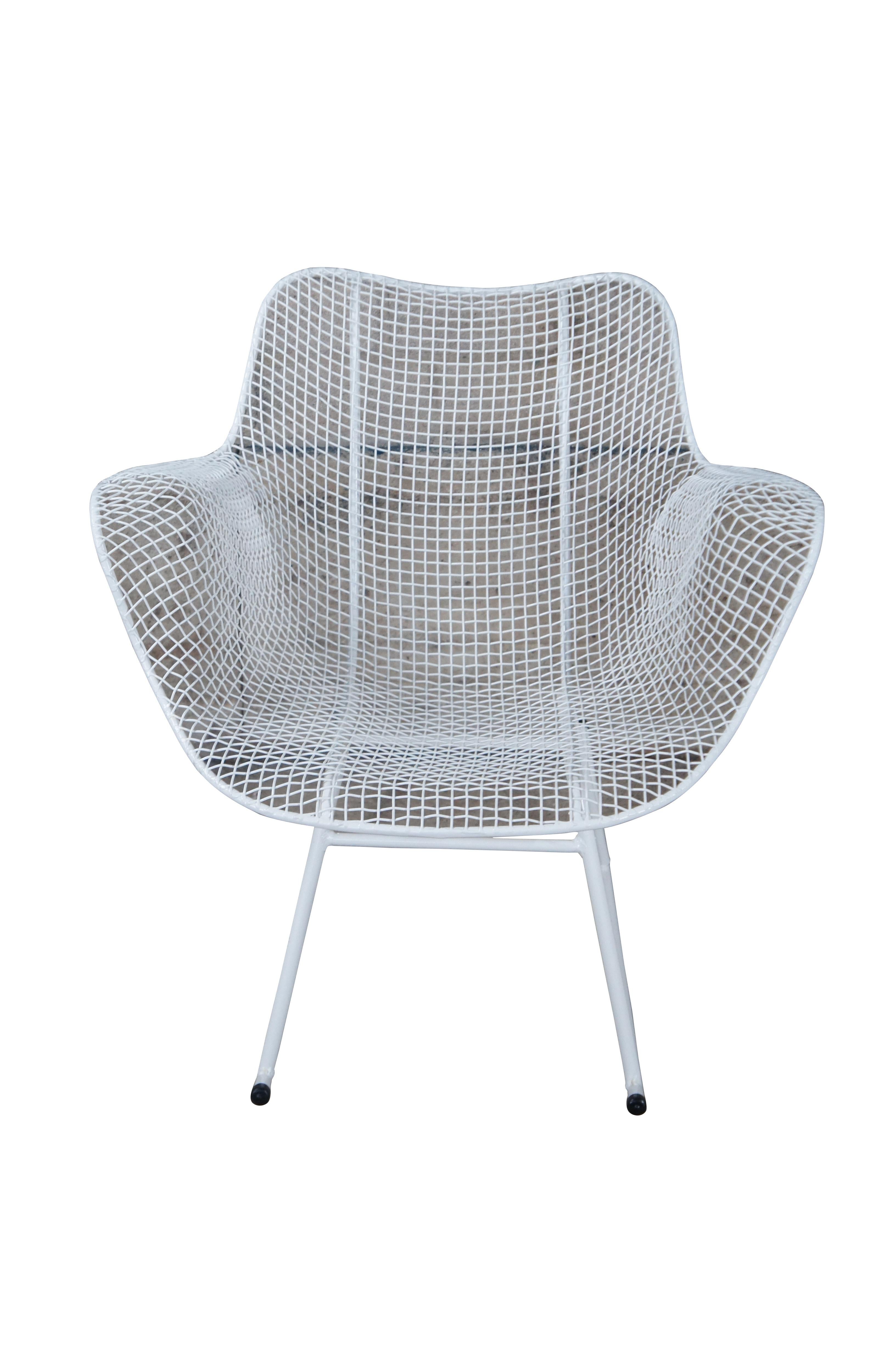 Mid century modern Russell Woodard Sculptura rocking chair / rocker armchair.  Made of wrought iron and mesh featuring a sculptured ergonomic design.

Dimensions:
27