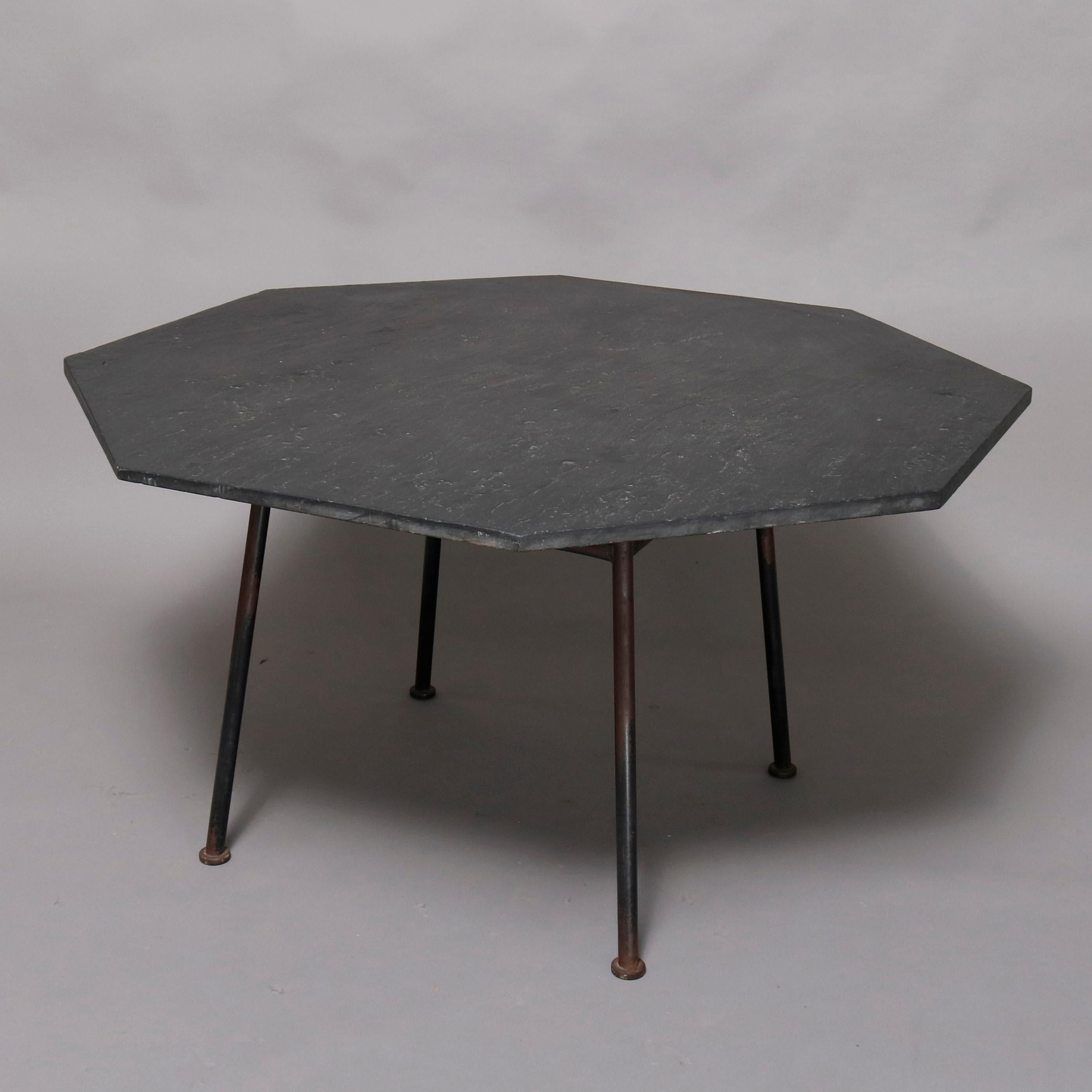 A Mid-Century Modern Russell Woodard dining set offers octagon slate top table on metal legs and six metal mesh chairs having vinyl cushions, circa 1960

***DELIVERY NOTICE – Due to COVID-19 we are employing NO-CONTACT PRACTICES in the transfer of