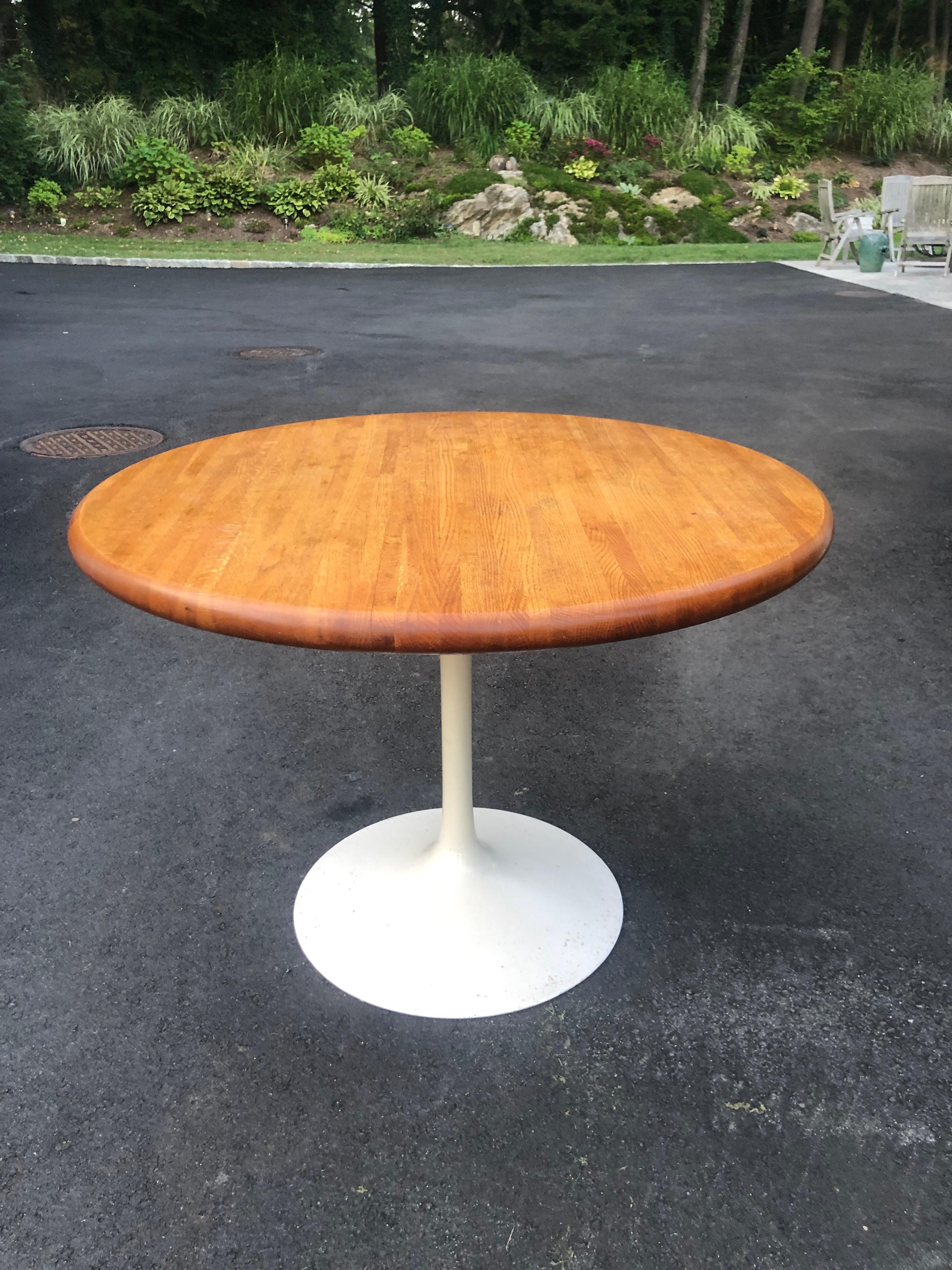 Mid-Century Modern Saarinen tulip table. This custom table has a thick Butcher block top. Perfect for that clean lines in a small kitchen space.