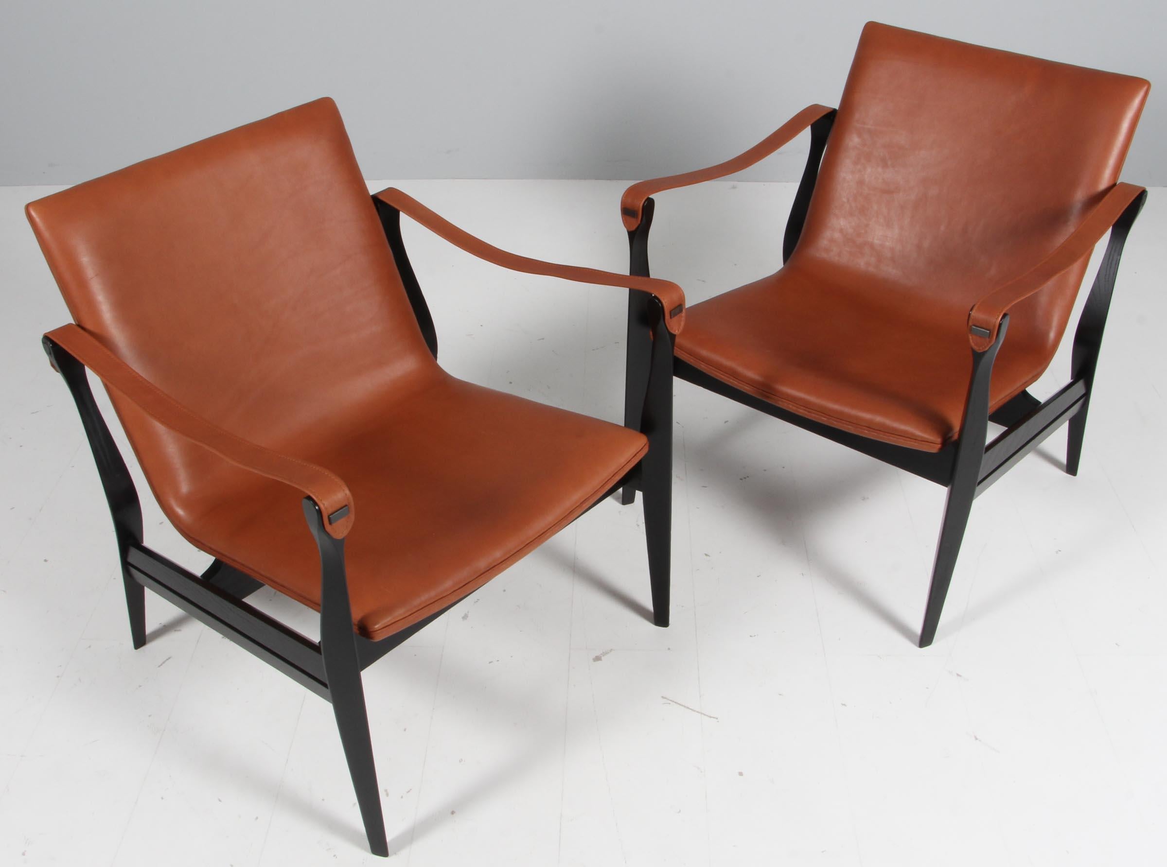 Very beautiful Safari Chair by Ebbe & Karen Clemmensen for Fritz Hansen designed in 1958 and produced in Denmark. The frame is made of ash and the seat is newly upholstered with a brown leather. Both chairs are in a very good condition, refurbished