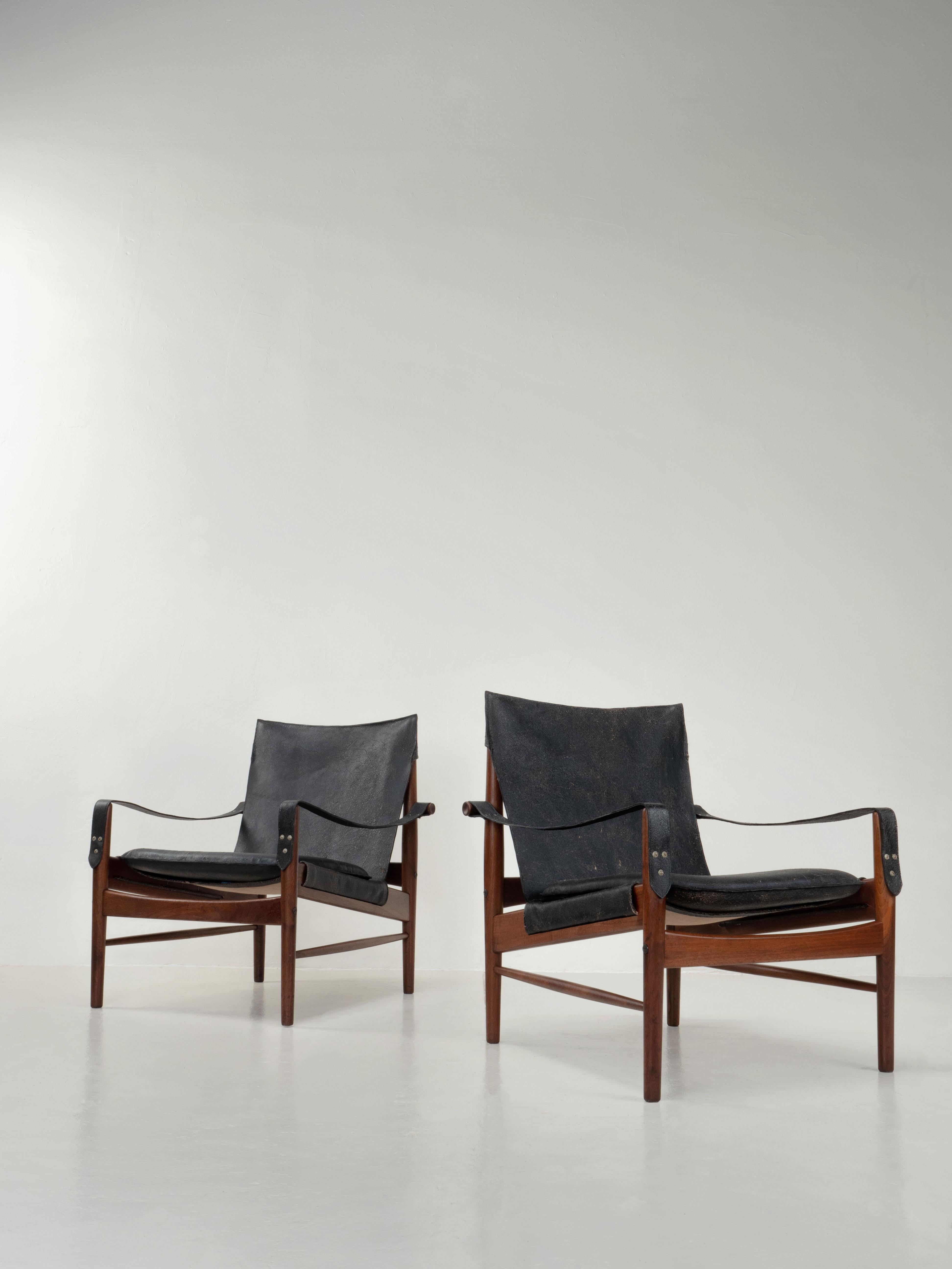 Hans Olsen designed Safari chairs. Viska Mobler, Sweden 1960's.

Stunning chairs in solid walnut. Wood frames has been refinished and oiled, some normal wear and patina to the wood remains. New foam and new black belted leather slings. We chose a