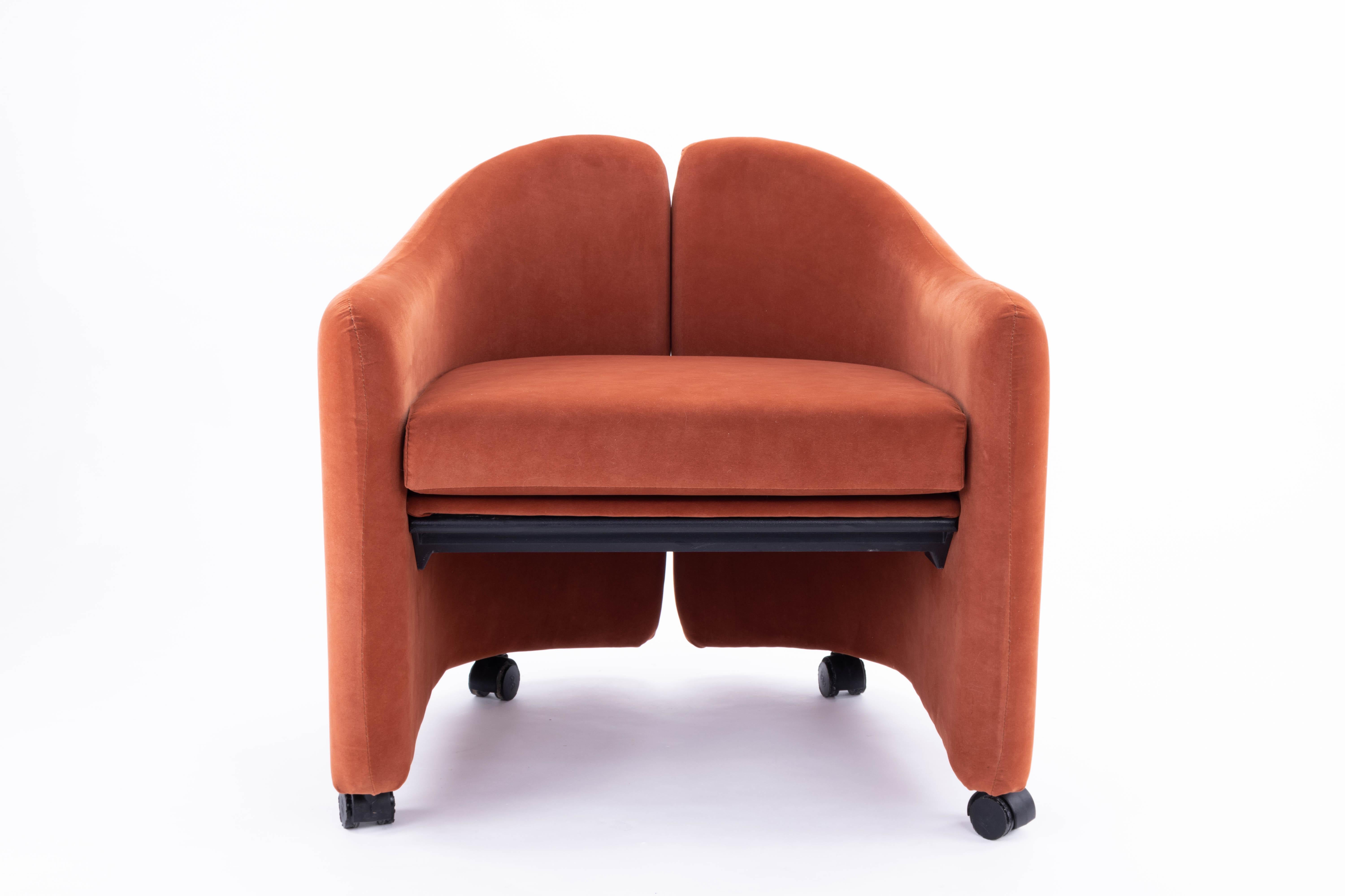 Armchair designed by Eugenio Gerli for Tecno Italia and manufactured in Spain under license by the Martinez Medina Company in salmon color. Metal structure, padded in polyurethane foam, covered with Alcantara fabric. Piece in original condition and