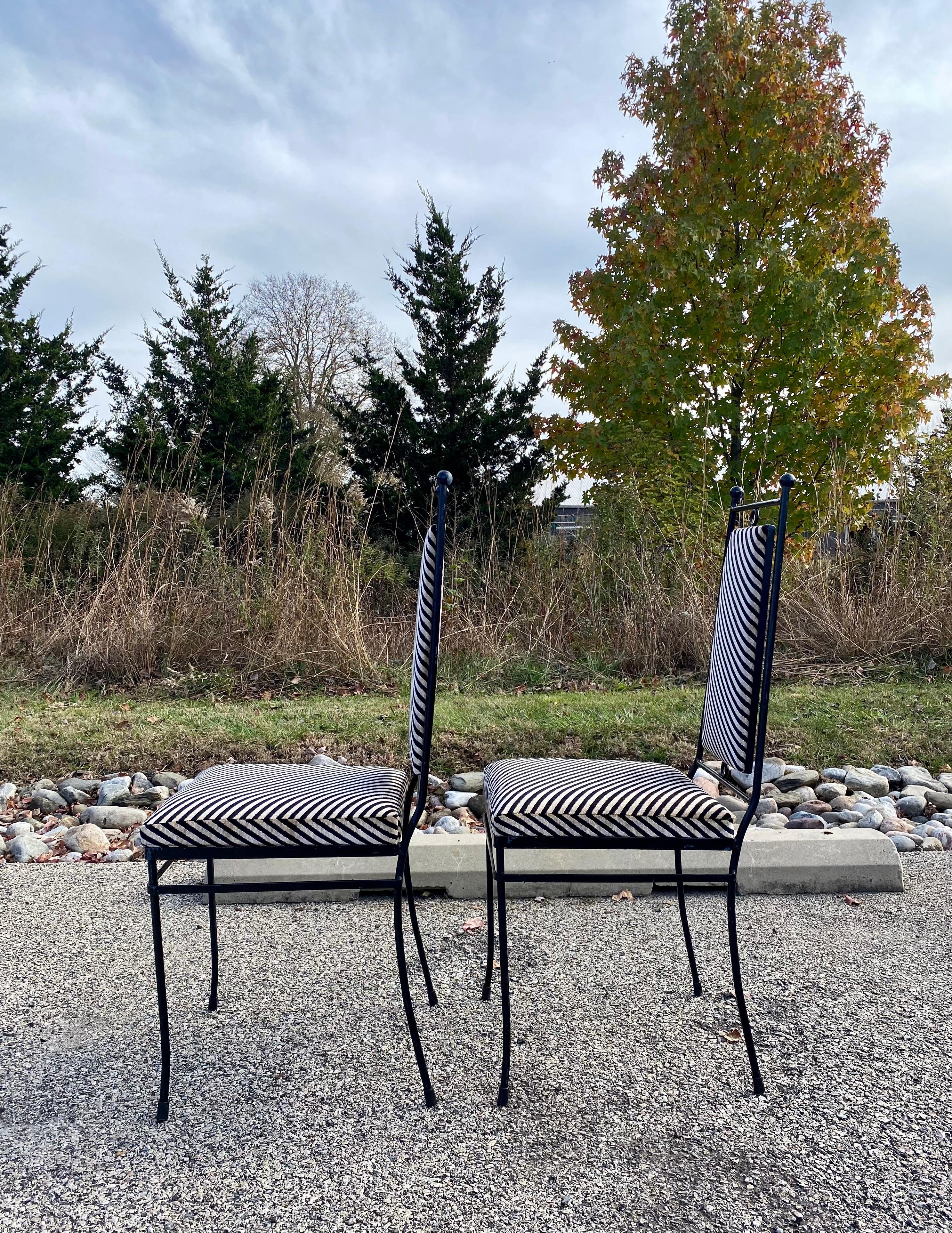 Pair of Mid0-Century Modern black metal side chairs newly upholstered in a plush velvet diagonal stripe by Lee Jofa. These stylish accent chairs feature a simple modern frame with circle details and ball finials. Graphic occasional accent chairs,