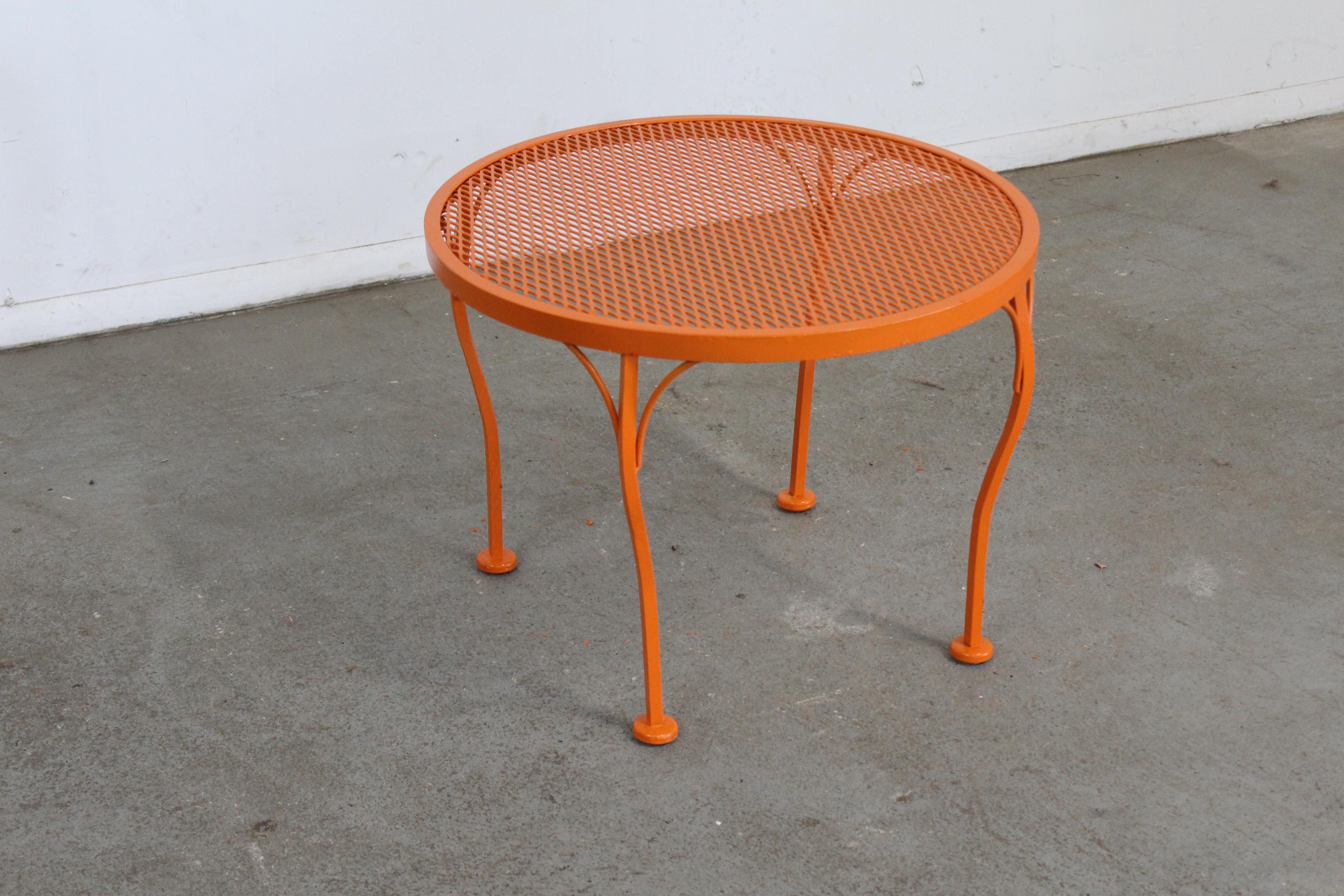 Mid-Century Modern Salterini Style Outdoor/Patio Coffee/Side Table

Offered is a mid-century outdoor/patio round table , circa 196o's. This piece is made of welded steel and features a diamond mesh and has been repainted in an atomic orange. This