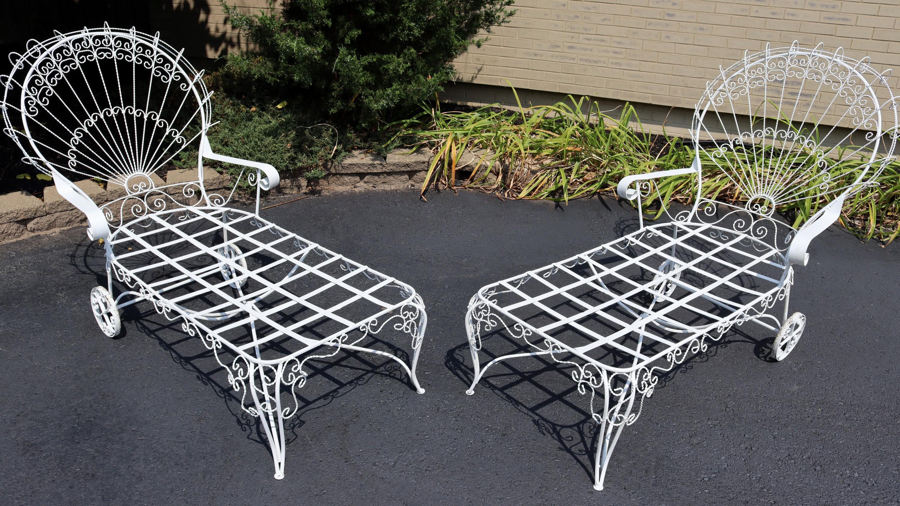For your consideration is a stupendous, outdoor, twisted wrought iron patio pair of chaise lounges, by Salterini, circa the 1950s. In very good vintage condition. The dimensions are 62