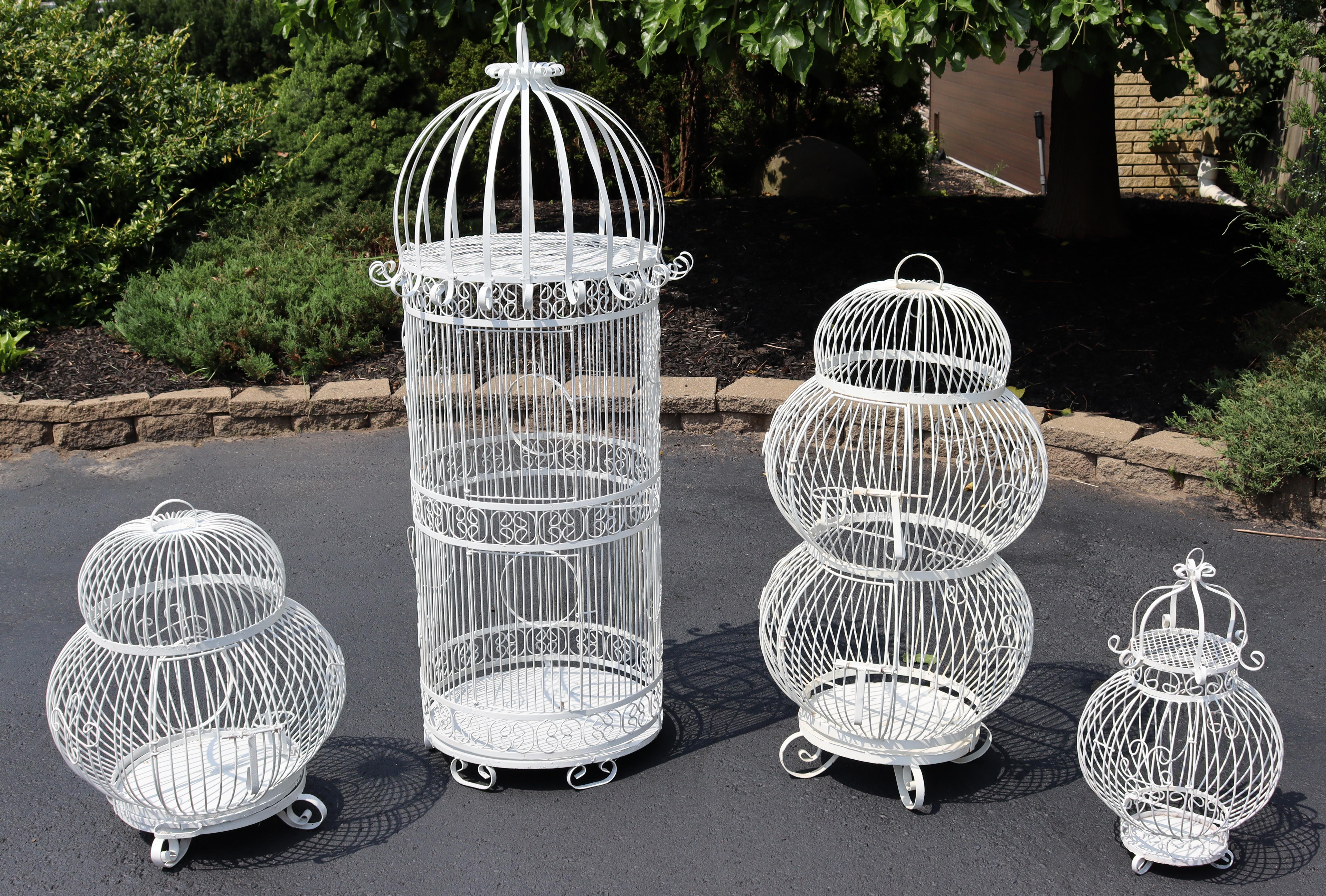 For your consideration is a stupendous, outdoor, twisted wrought iron patio set of four birdcages, by Salterini, circa the 1950s. In very good vintage condition. The dimensions of each are 22