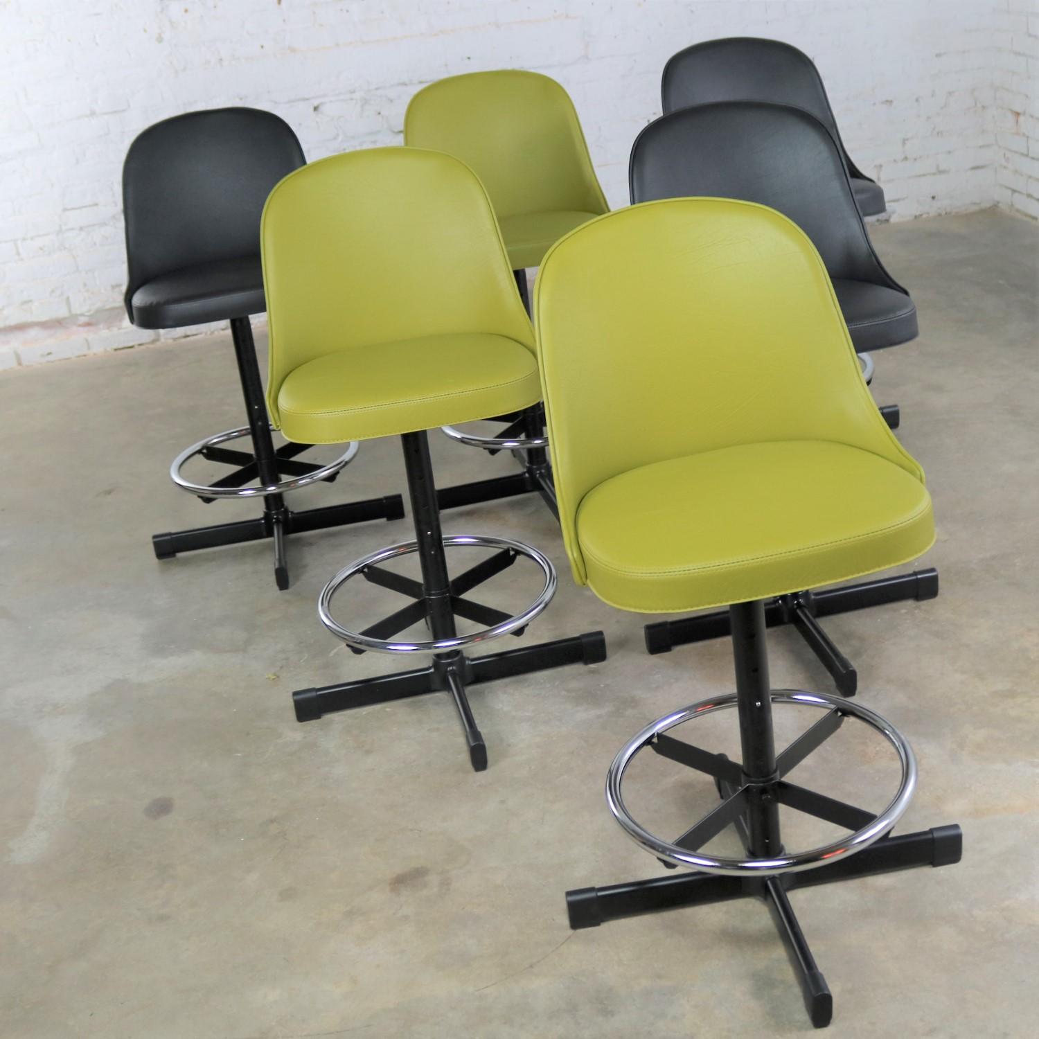 Handsome Samsonite Mid-Century Modern adjustable bar or counter stools. They have multiple adjustment positions. These awesome stools are NOS, new old stock. There are 2 sets of 3. You may choose black Naugahyde or asparagus Naugahyde. They are