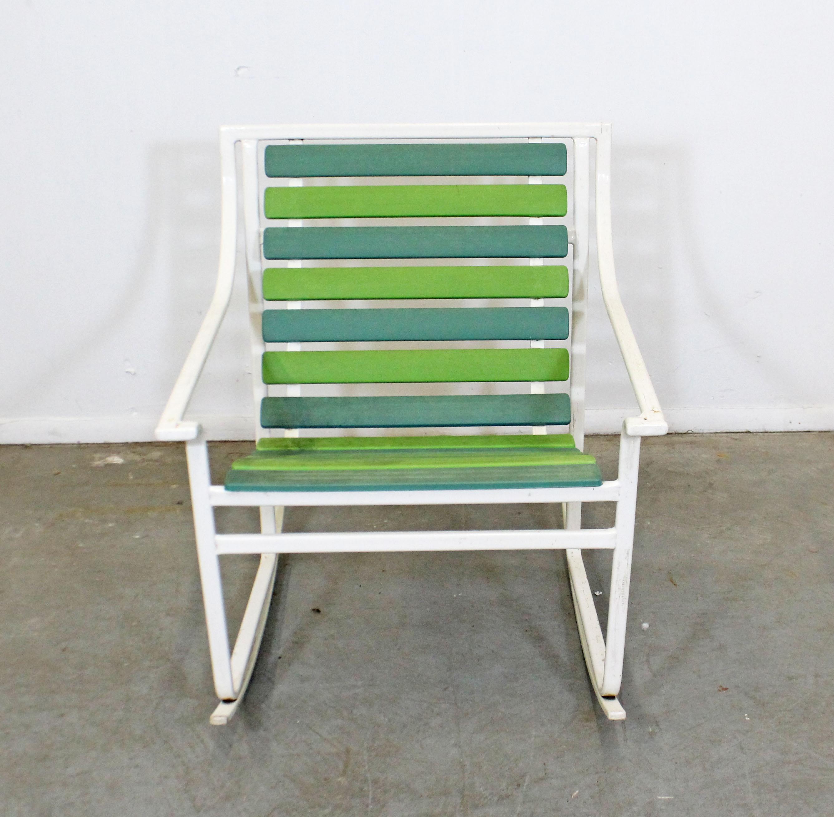What a find. Offered is a rare outdoor rocking chair with a tubular steel frame and blue/green plastic slats. It was made by Samsonite, (circa 1960s). It is good structurally sound condition showing age wear including surface scratches/chips,