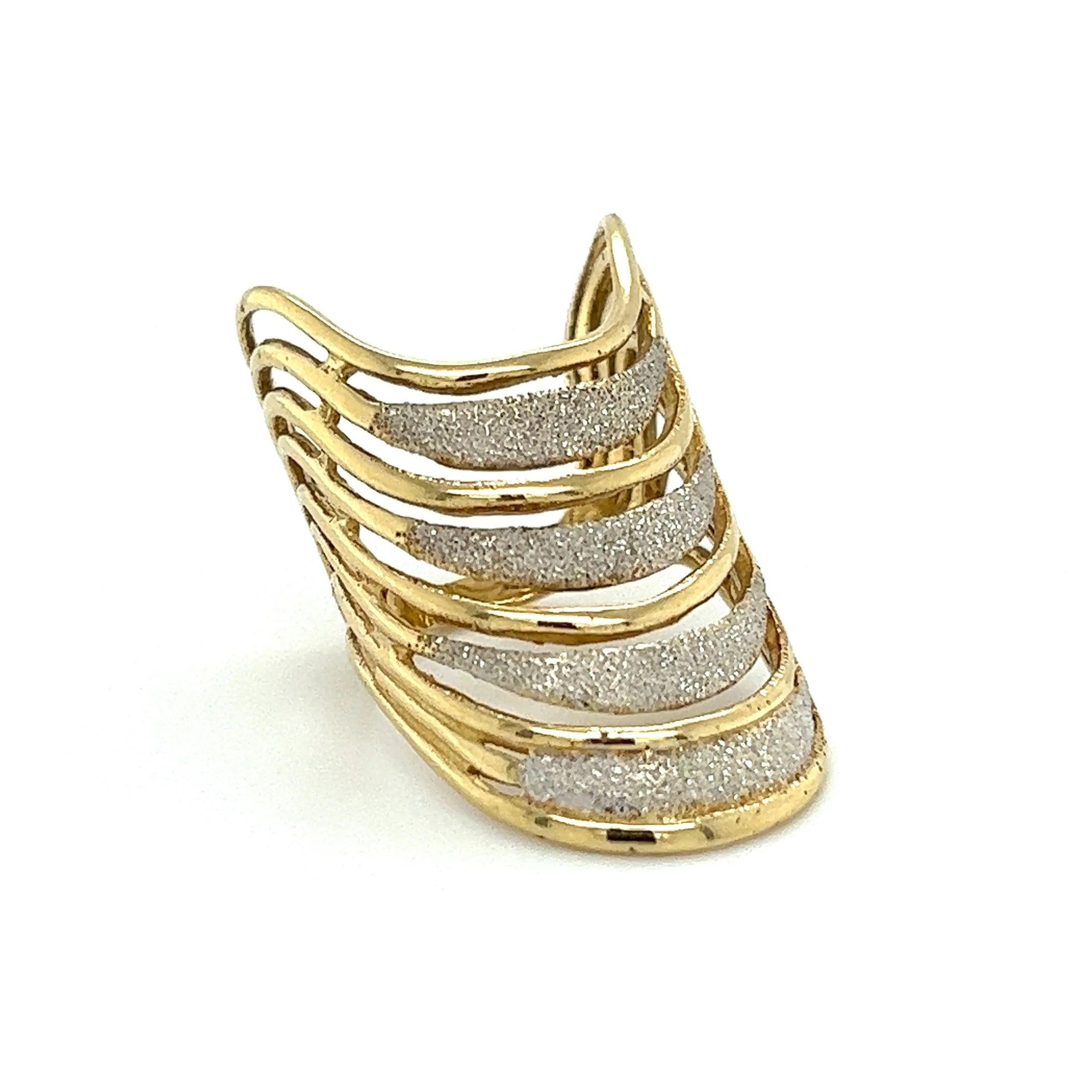 Simply Beautiful! Dynamic Designer Sand Blasted Gold Wave Four Row Band Cuff Ring. Each Band Hand crafted in Sand Blasted 14K Yellow Gold. Measuring approx. 1.20” l x 0.76” w x 0.77” h. Ring size 6.5, we offer ring resizing. More Beautiful in Real