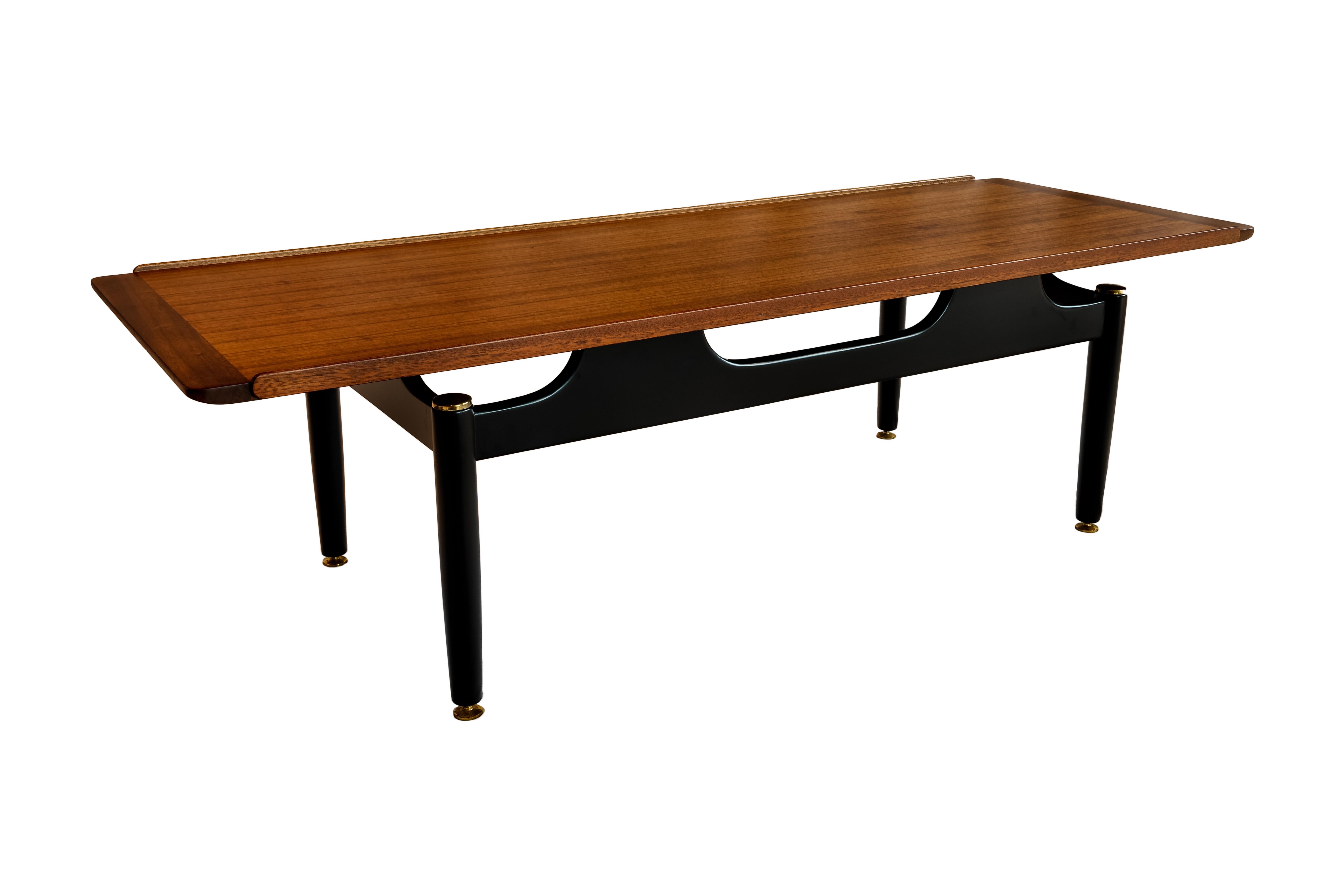 Mid-Century Modern Bubinga wood coffee table attributed to Jens Risom, circa 1959.
Elegant, sophisticated Mid-Century Modern bubinga wood coffee table attributed to Jens Risom, with Bubinga wood floating top and black lacquered turned legs with