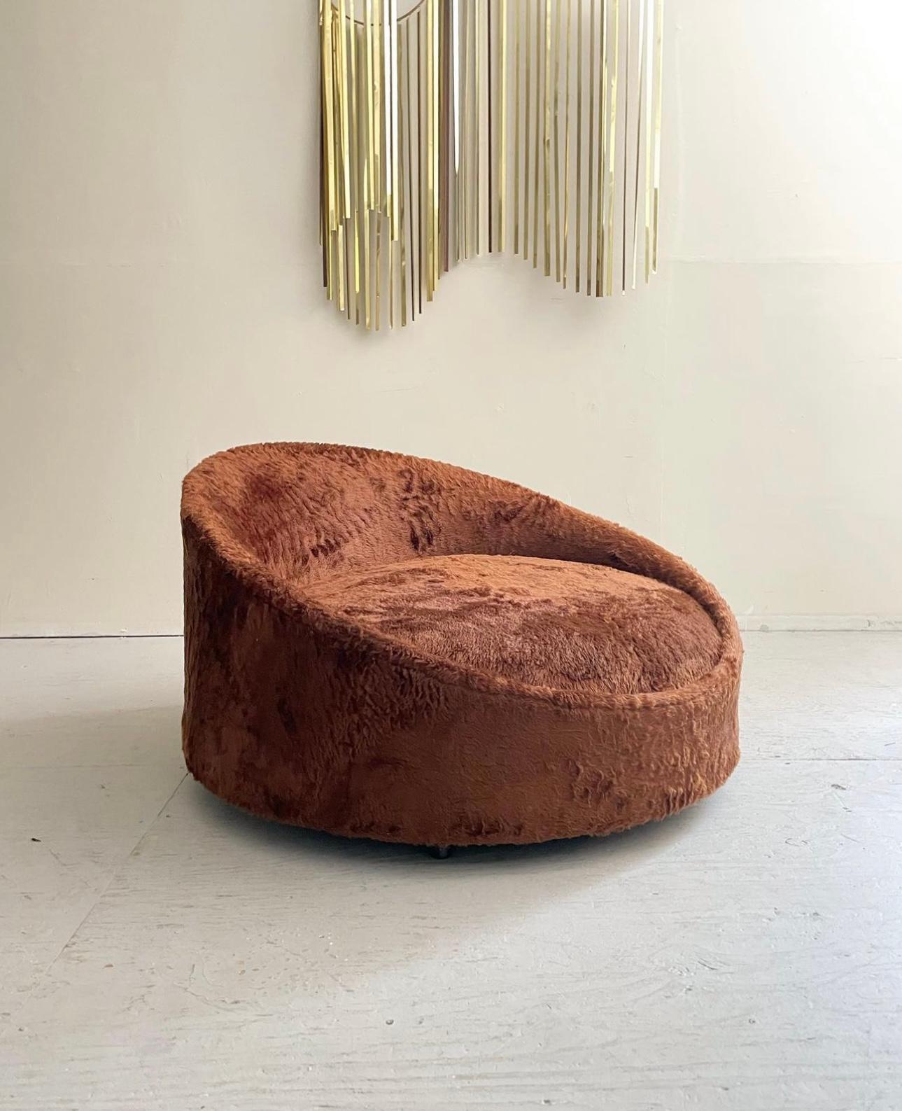 Mid-Century Modern “Satellite” Lounge Chaise Designed by Adrian Pearsall. Comes newly reupholstered in a luxurious brown fur fabric. The chaise flairs on rolling casters for ease of placement. Can easily accommodate 2 people making this a perfect