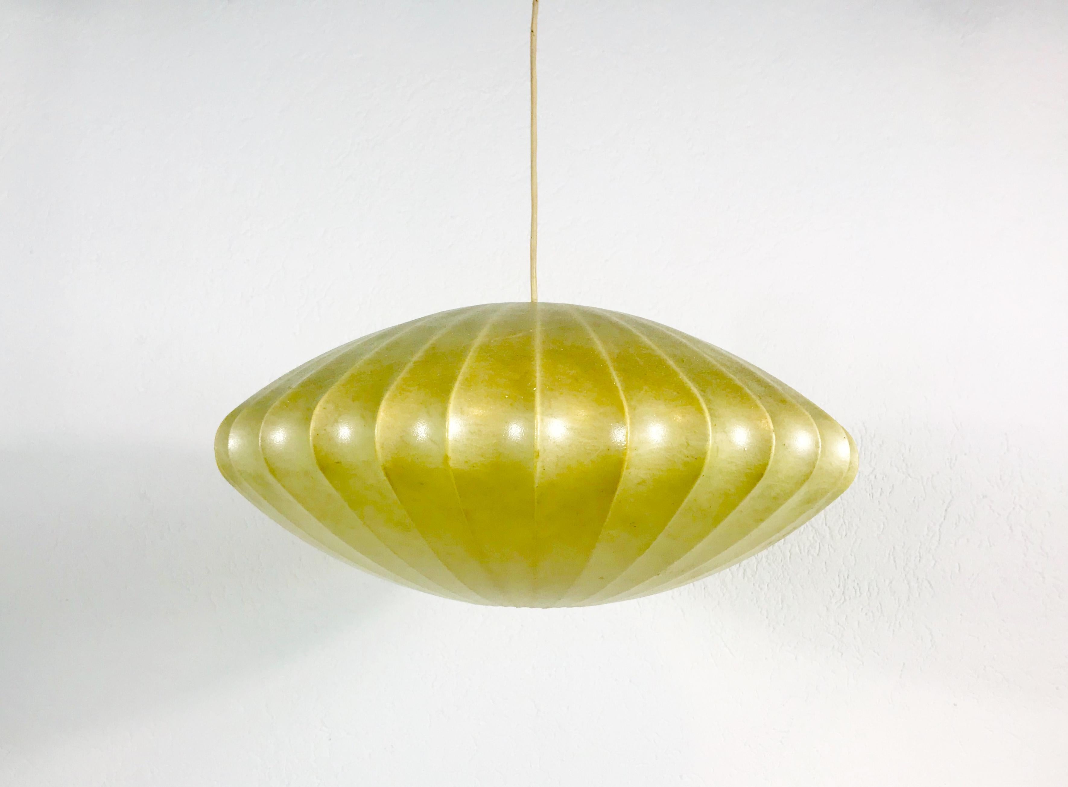 A cocoon hanging lamp made In the 1960s by George Nelson. The material of the lamp is transparent resin.

The light requires one E27 light bulb.
          