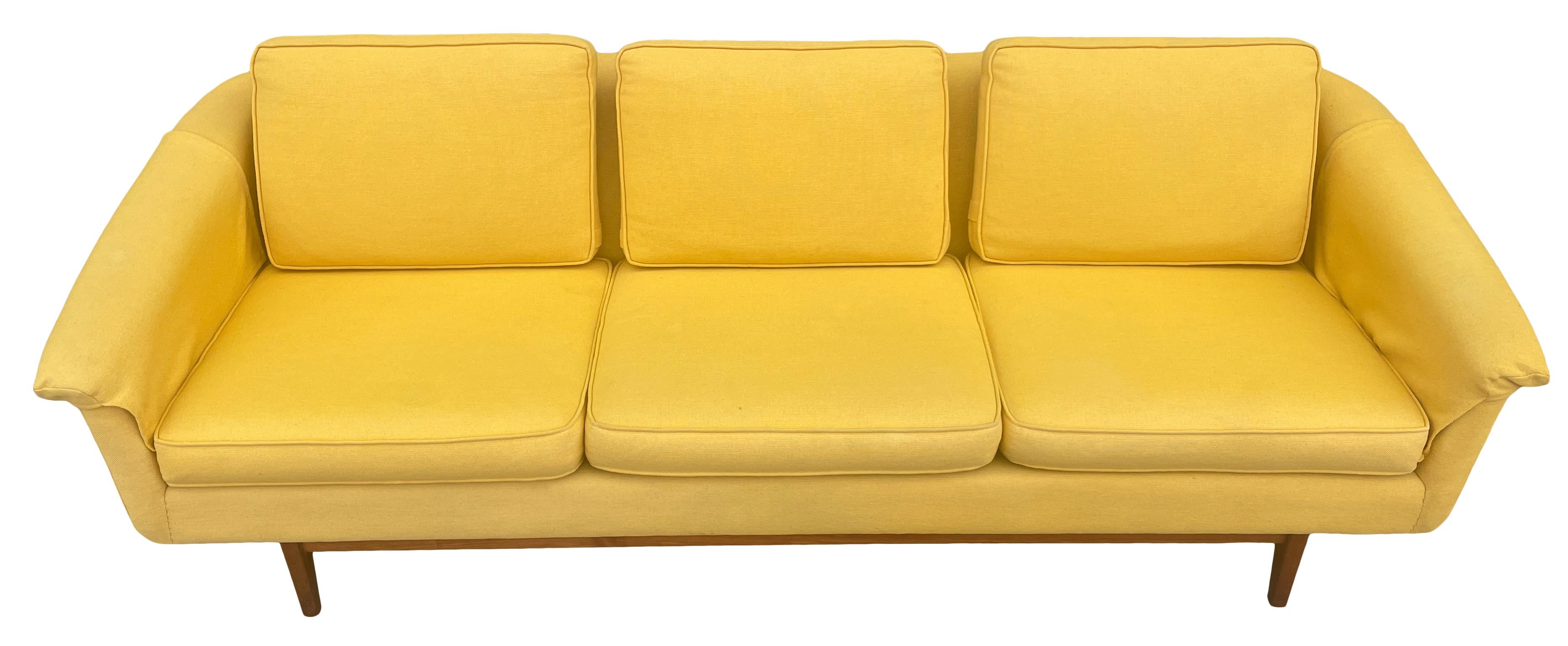 Mid-Century Modern 3 seat low Scandinavian sofa couch by DUX in mustard yellow with teak base. All Original woven Upholstery in beautiful condition. Has 2 extra small pillows and arm covers. Wonderful design and very comfortable. Show little wear