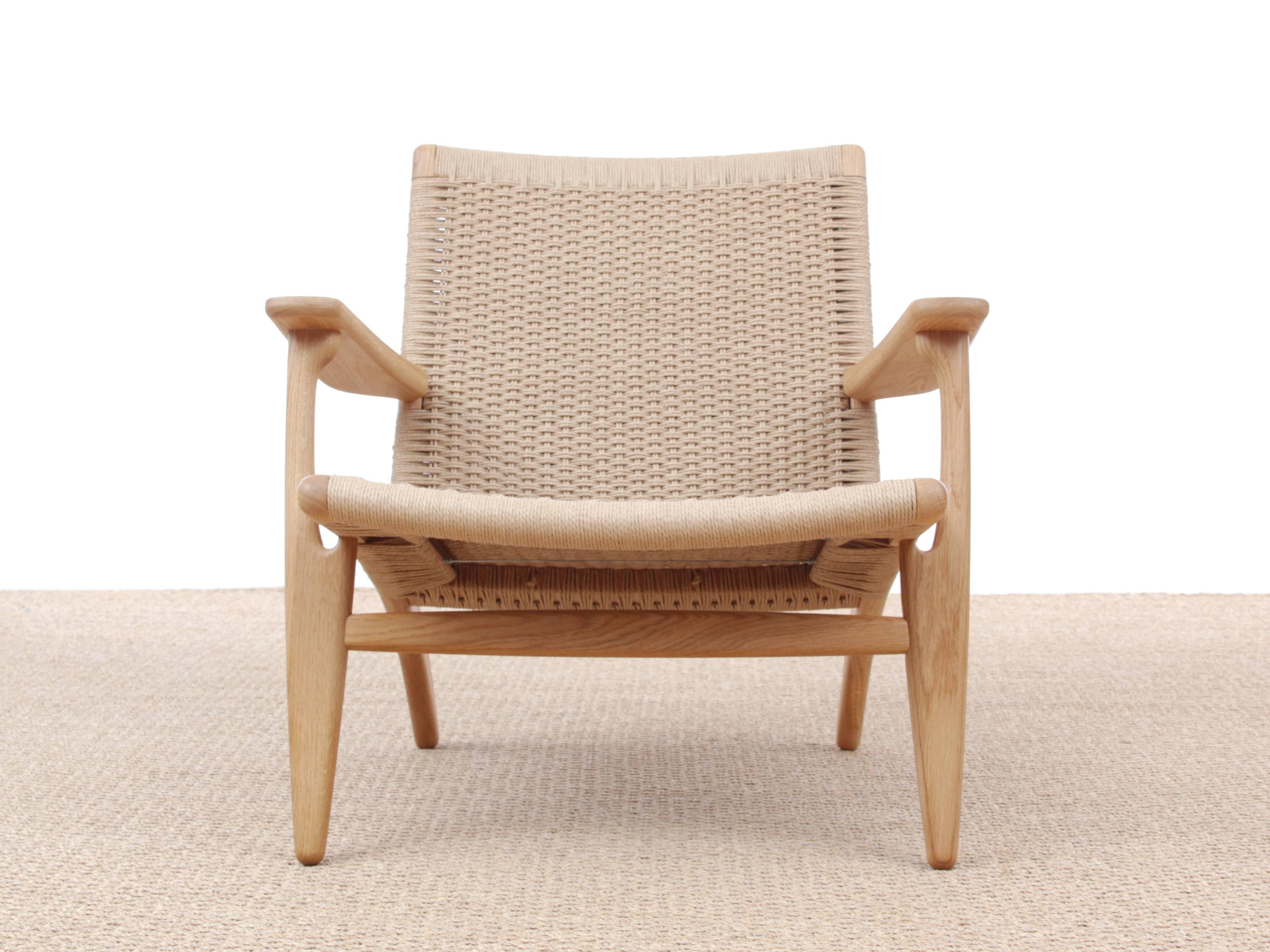 Mid-Century Modern CH 25 armchair by Hans Wegner. New product. Designed in 1950, the CH25 lounge chair was one of the first four chairs Hans J. Wegner created especially for Carl Hansen & Søn within his first three weeks with the company. The CH25