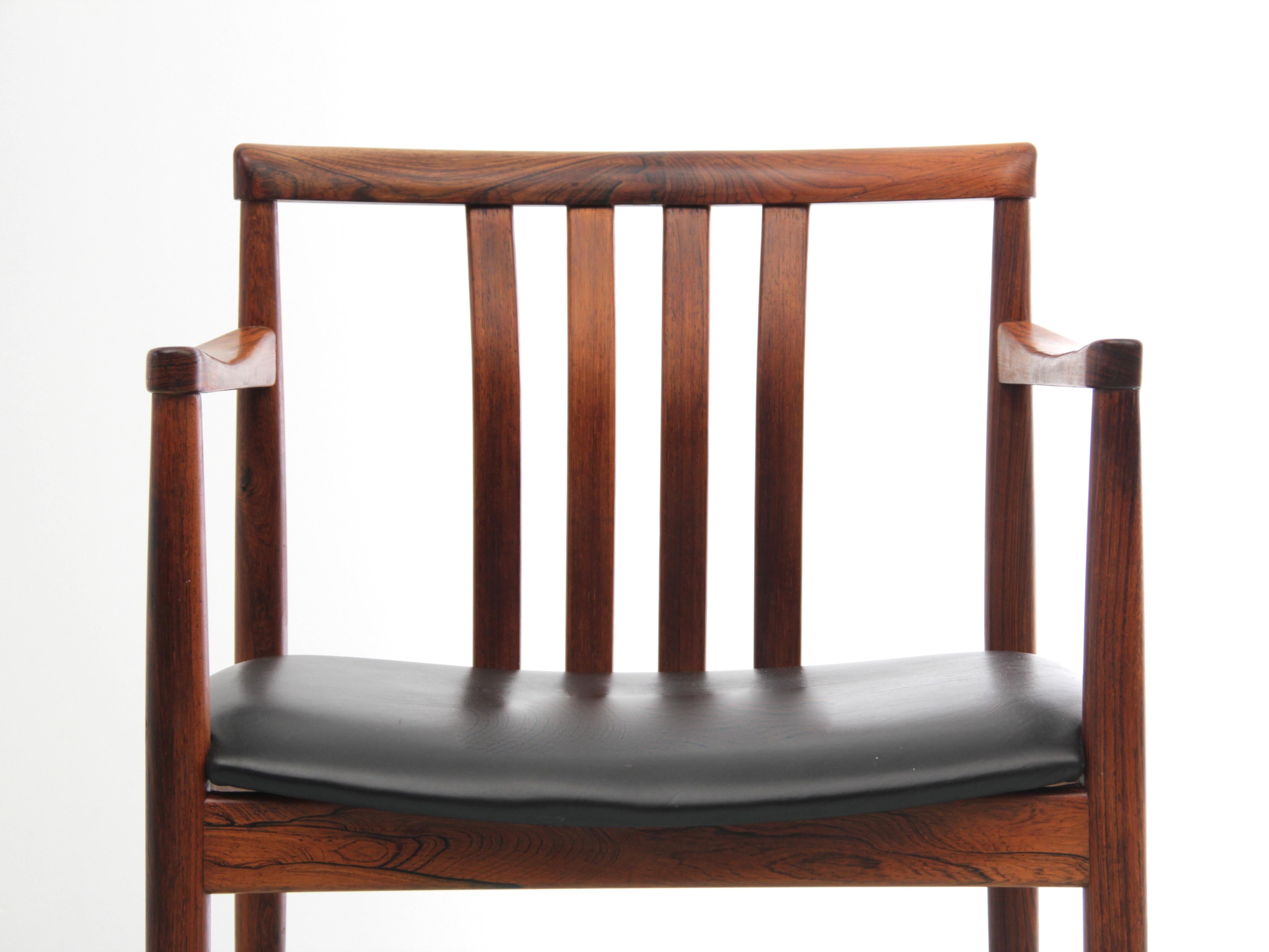 Mid-Century Modern Scandinavian armchair in Rio rosewood by Westnofa. Original black leather seat.