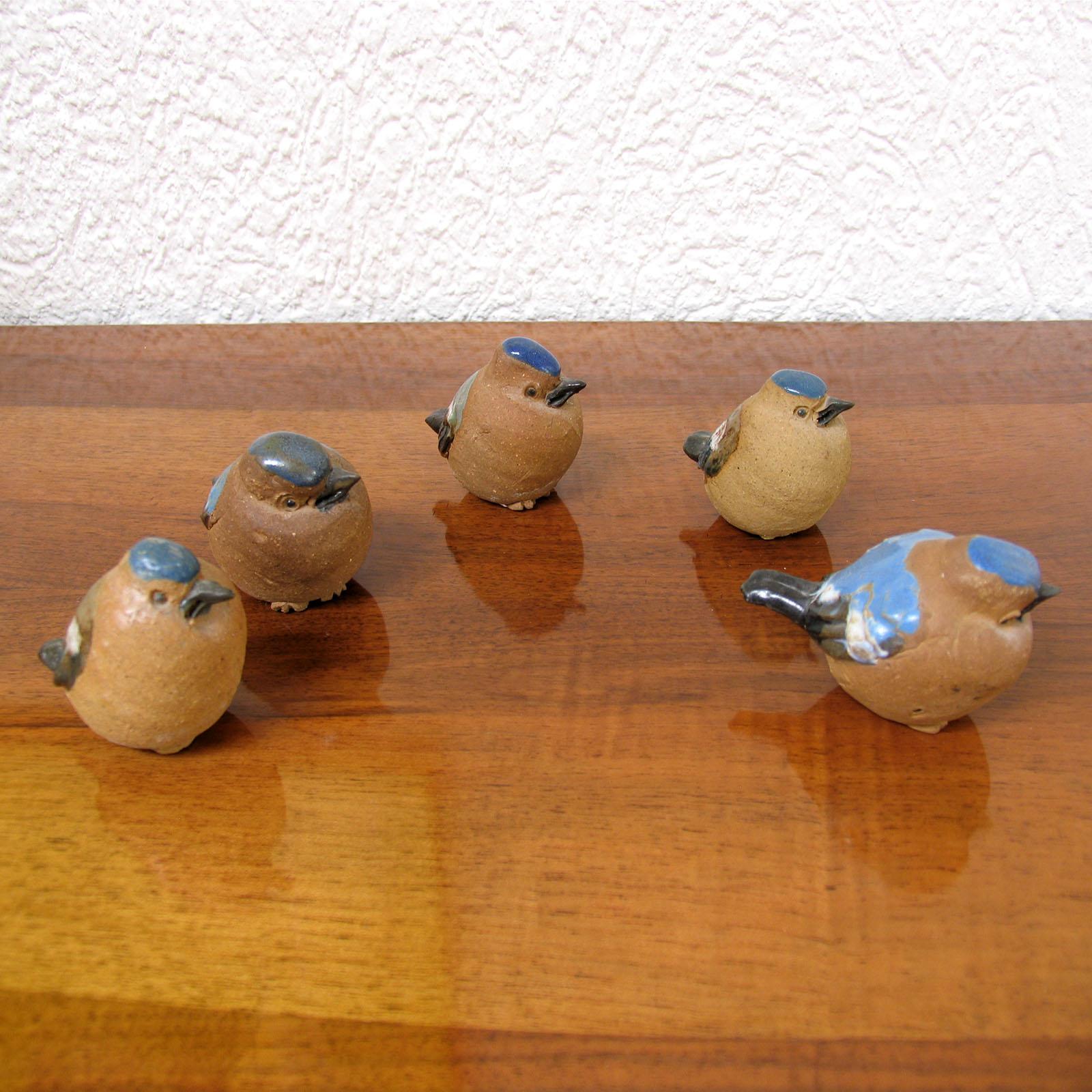 Mid-Century Modern Scandinavian ceramic birds figurines, Sweden, 1960s.
Set of five joyful birds, sparrows, made of stoneware, in natural color, partly glazed in beautiful shades of blue. Artist's monogram impressed under the bottom. In excellent