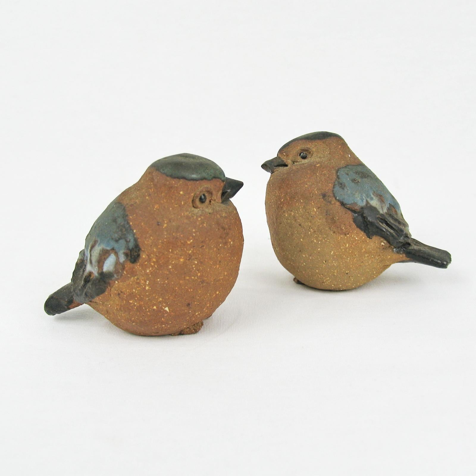 Mid-Century Modern Scandinavian ceramic birds figurines, Sweden, 1960s.
A pair of joyful birds, sparrows, made of stoneware, in natural color, partly glazed in beautiful shades of blue. Artist's monogram impressed under the bottom. In excellent
