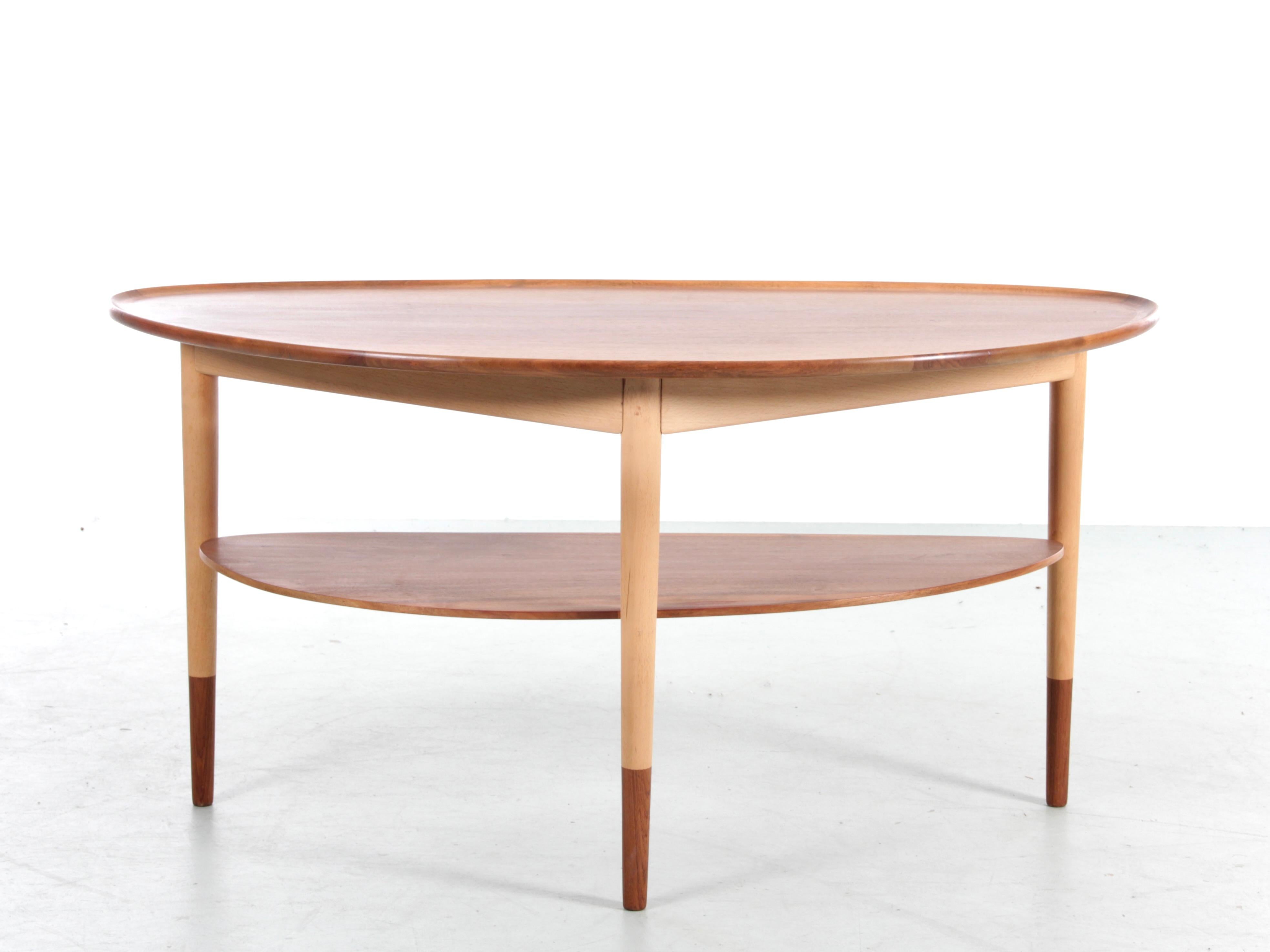 Mid-Century  modern scandinavian coffeee table or side table in walnut. Beech frame. Walnut top and legs. Banish work.  
