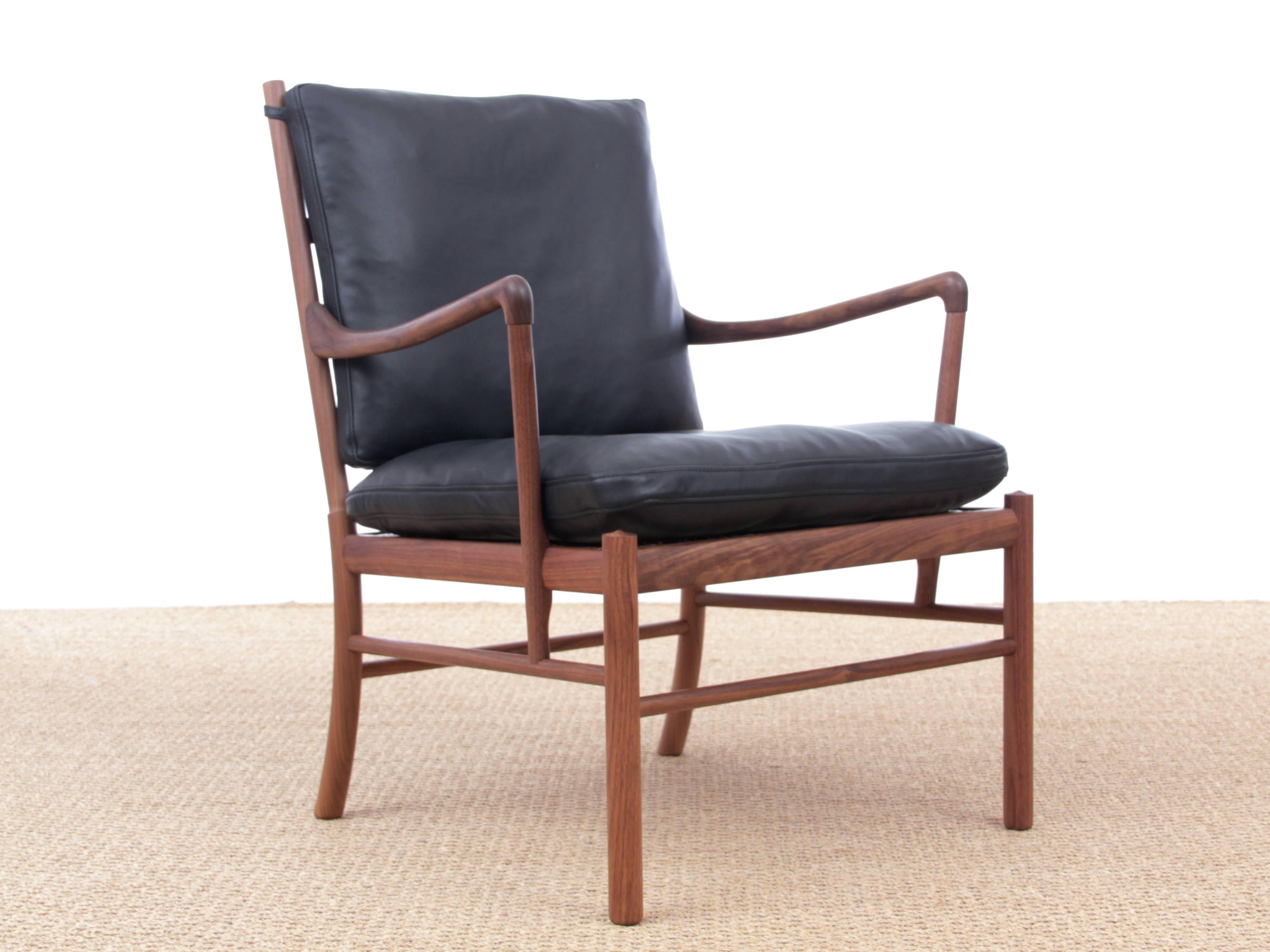 Mid-Century Modern Scandinavian Colonial armchair OW 149 in walnut by Ole Wanscher. Oiled walnut frame. Removable seat in cane. Cushions available in fabric, Loke leather or Sif leather. (See pictures)

Designed in 1949, Ole Wanscher's colonial