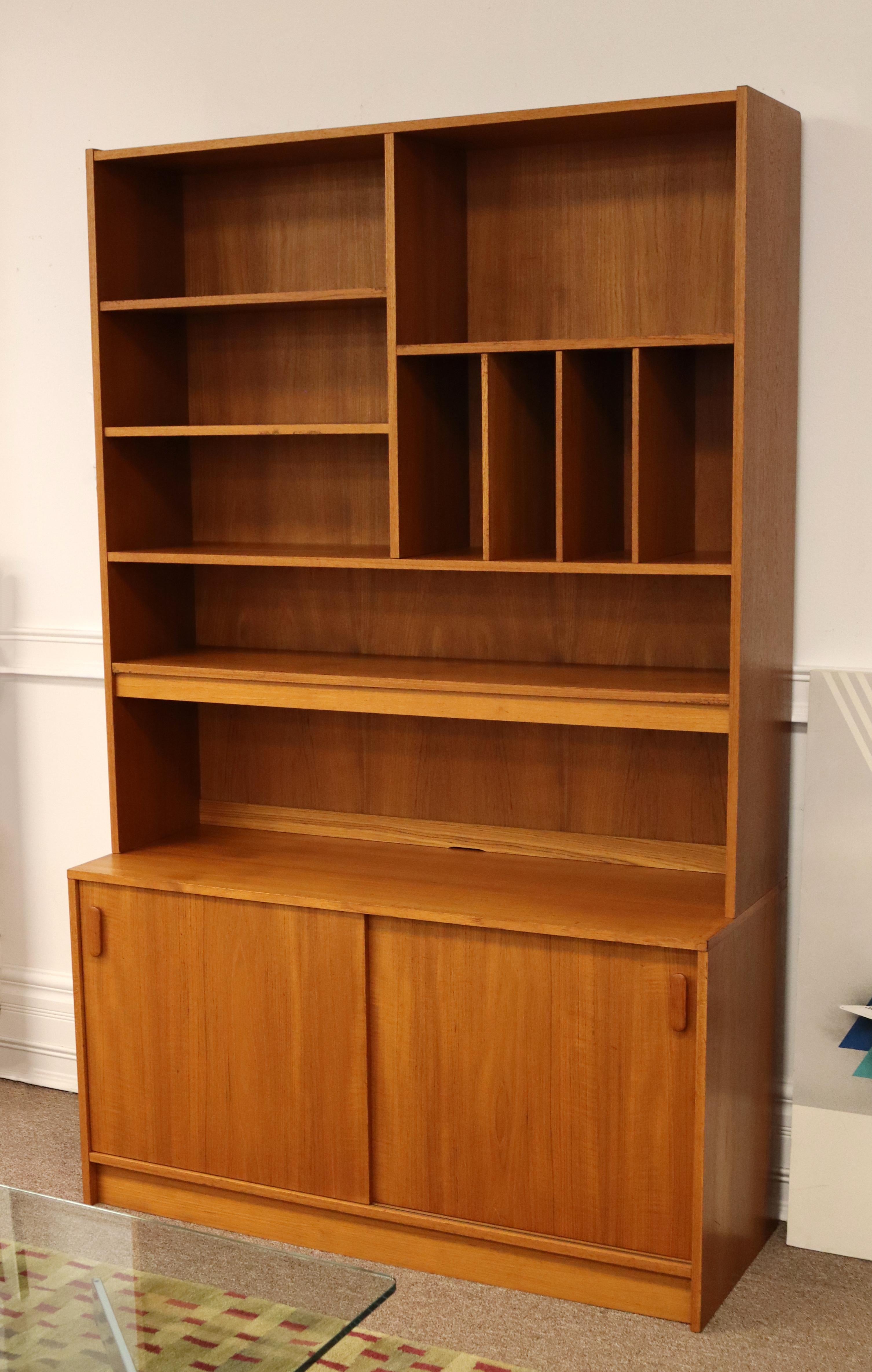 For your consideration is a fantastic, Scandinavian wall unit, made of teak, made in Denmark, circa the 1960s.In excellent condition. The dimensions are 47.5