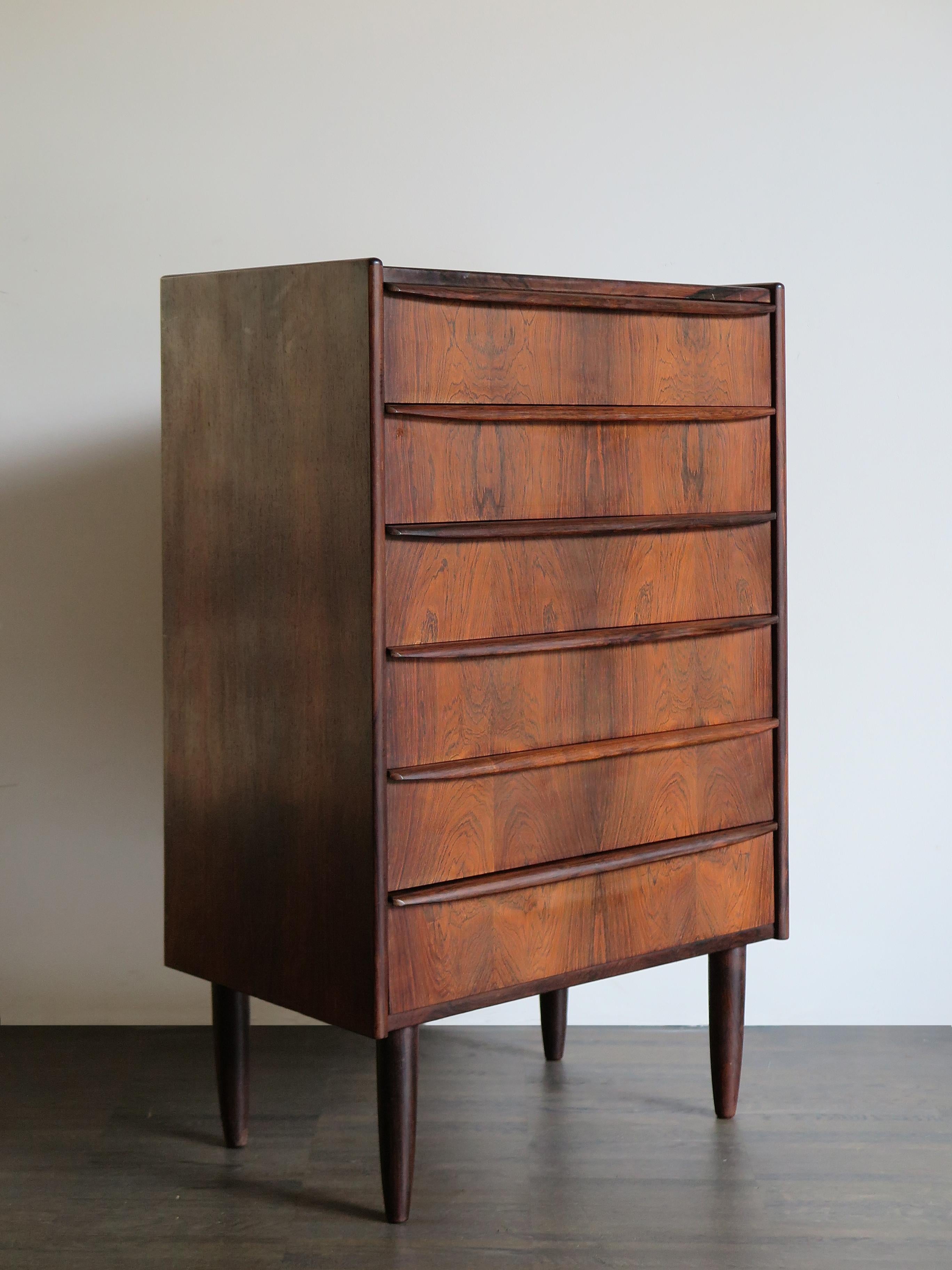 Scandinavian dark wood chest of drawers, made in, 1960s.

Please note that the item is original of the period and this shows normal signs of age and use.
   