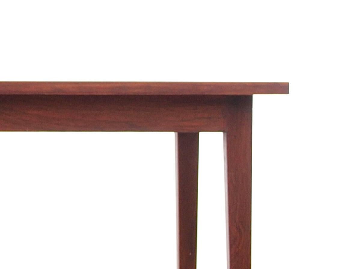 Mid-Century Modern Scandinavian desk or table in rosewood. One hidden drawer.