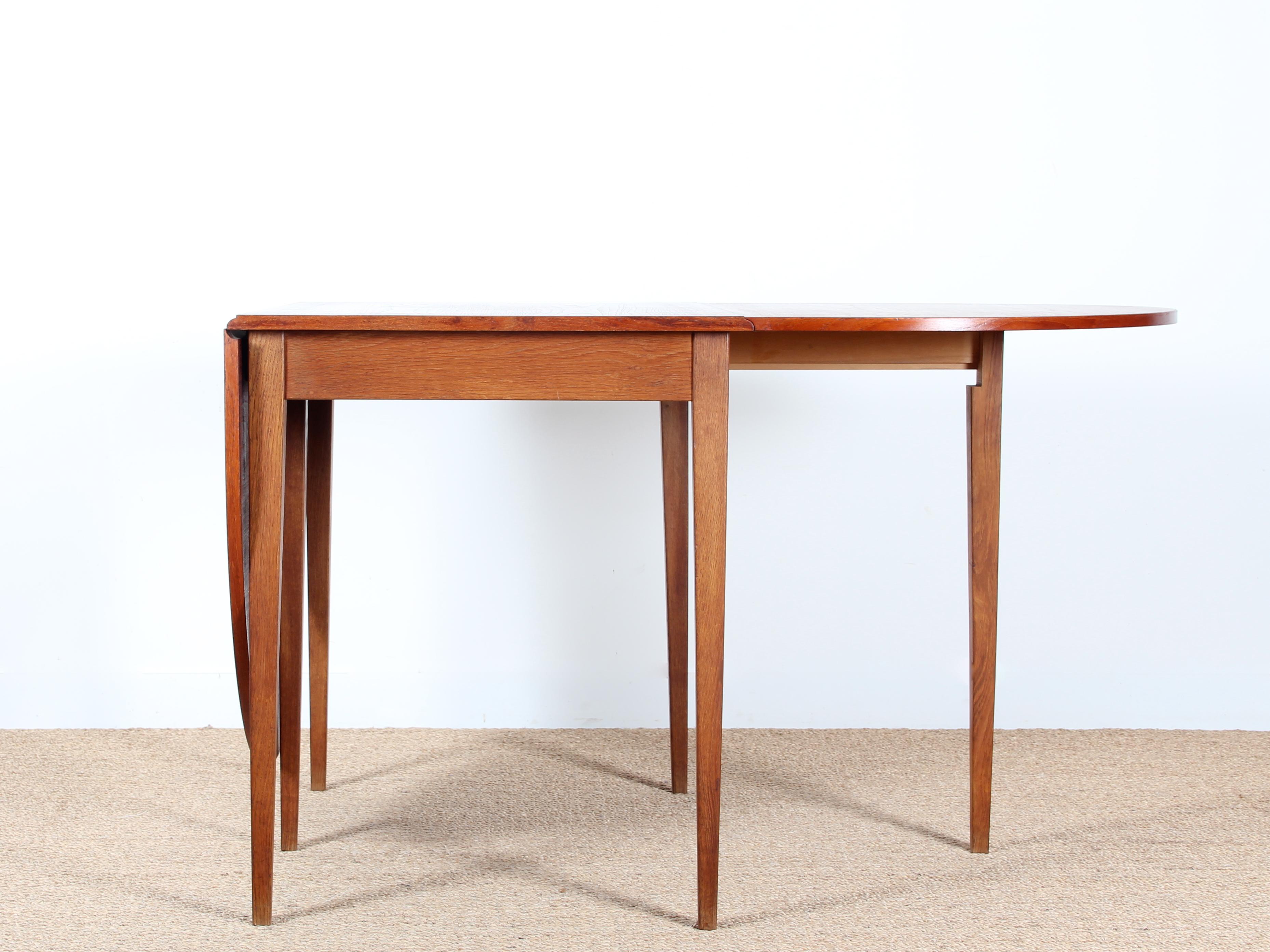 Mid-Century Modern Scandinavian dining table flap table in teak and oak for 2-6 seats. Perfect for small spaces.