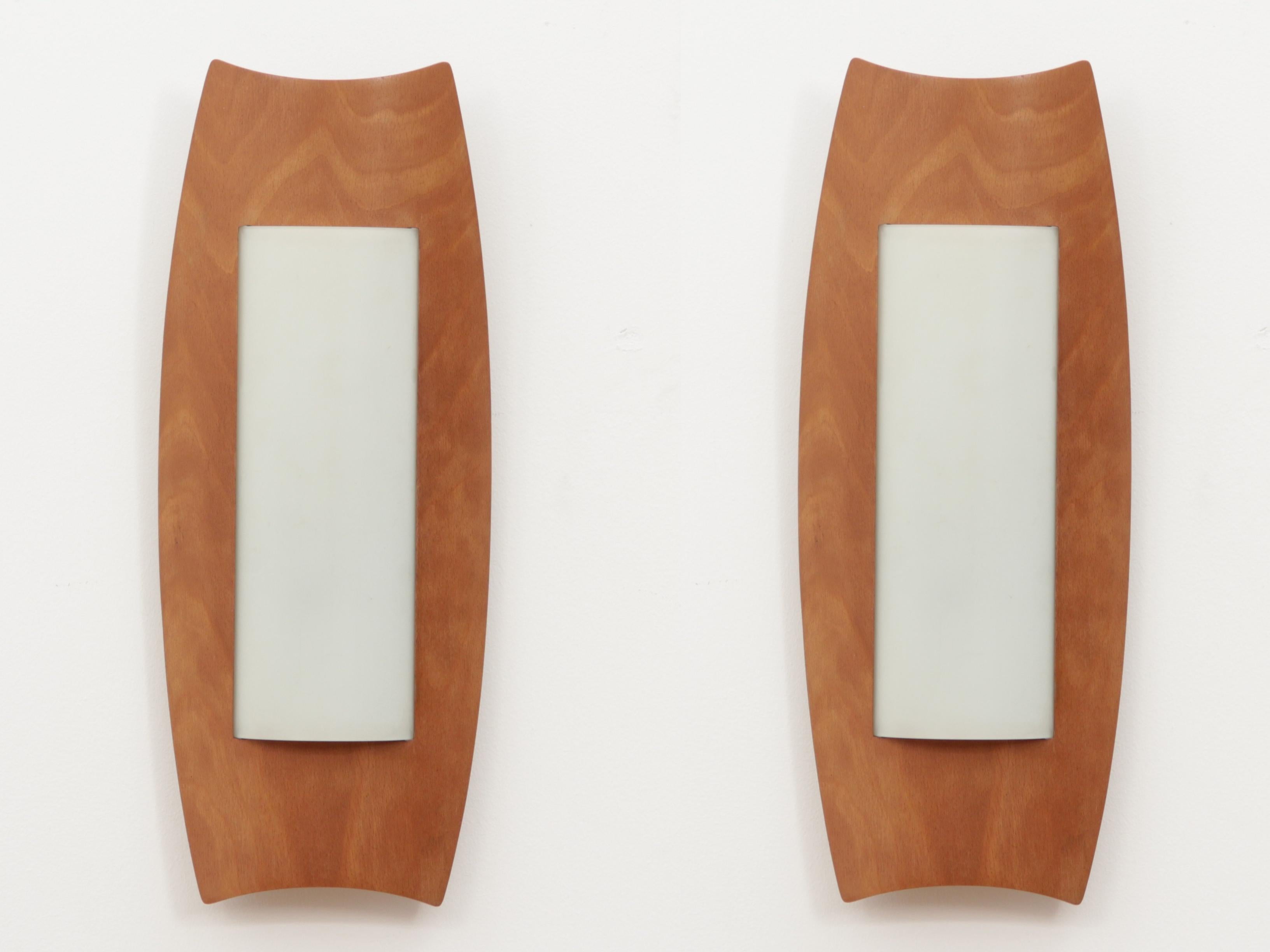 Mid-Century Modern scandinavian large wall lamps from the 70's. Beech plywood. Acrylic shades. New electrical system brought up to EU standard. E27 bulb. Price for the pair.