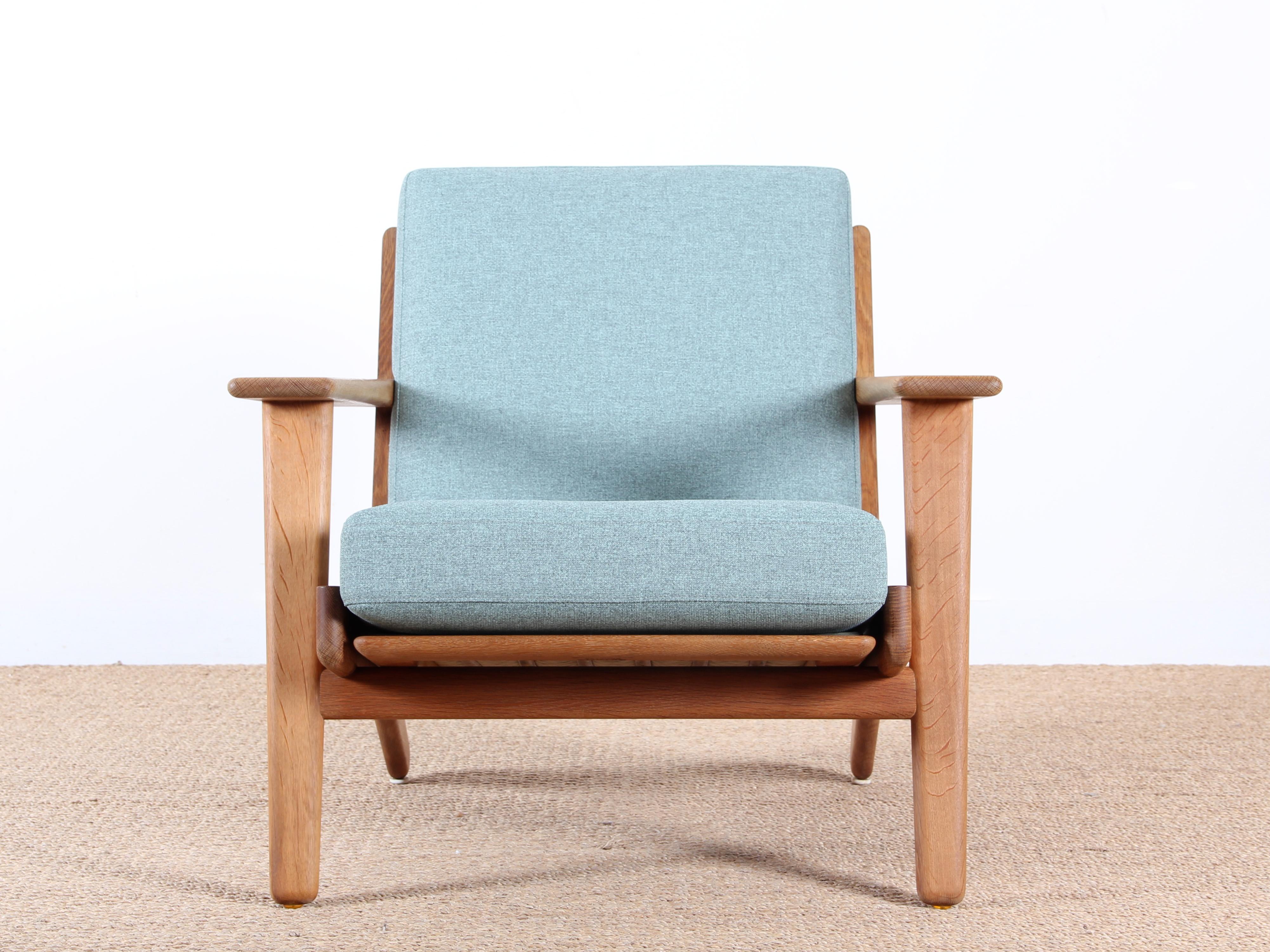 Scandinavian pair of armchairs model GE290 by Hans Wegner for GETAMA. Solid oak. New cushions refurbished by GETAMA in foam and Gabriel Step Melange Color 68118 fabric.