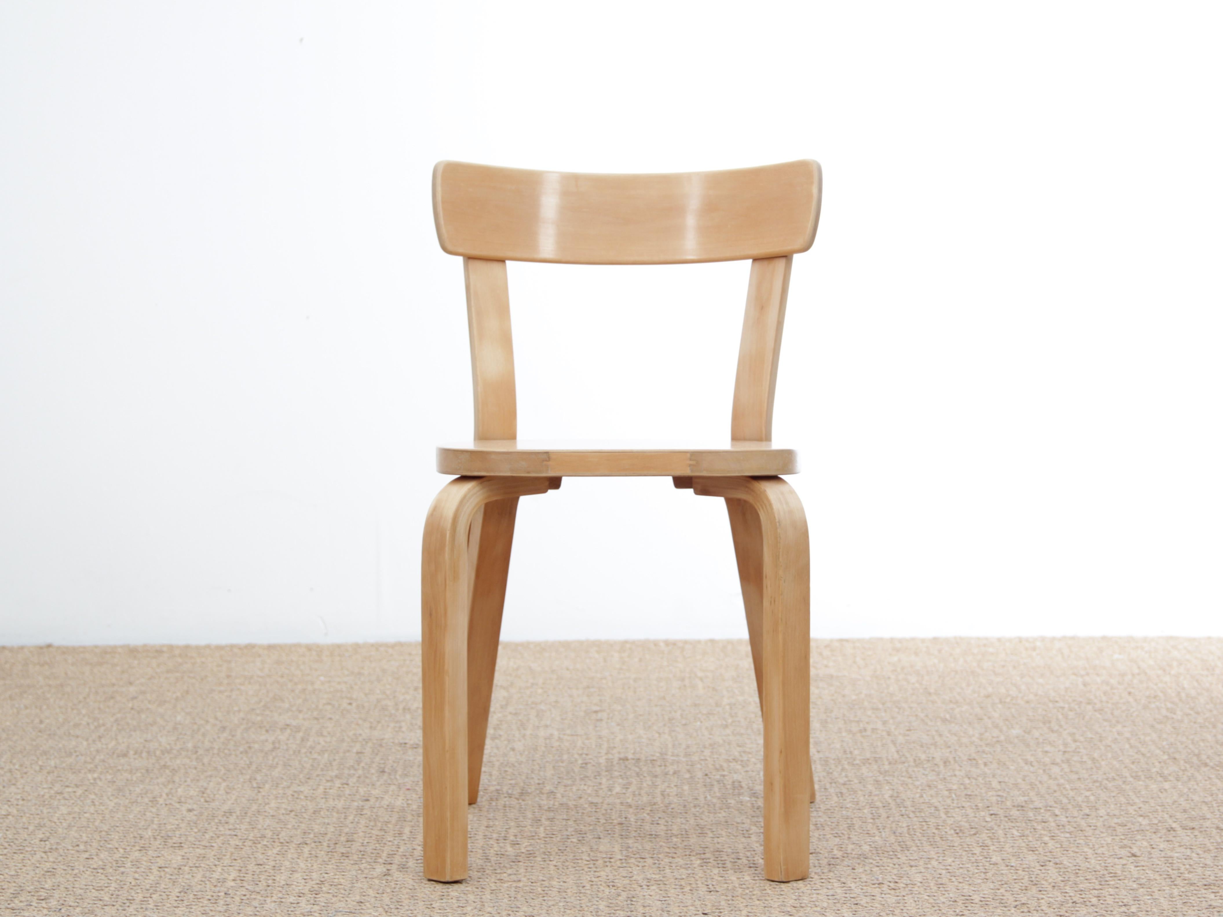 Mid-Century Modern Scandinavian pair of chairs model 69 by Alvar Aalto. Chair 69 is one of Artek’s most popular chairs, a universal wooden chair in the tradition of Classic kitchen and café chairs.