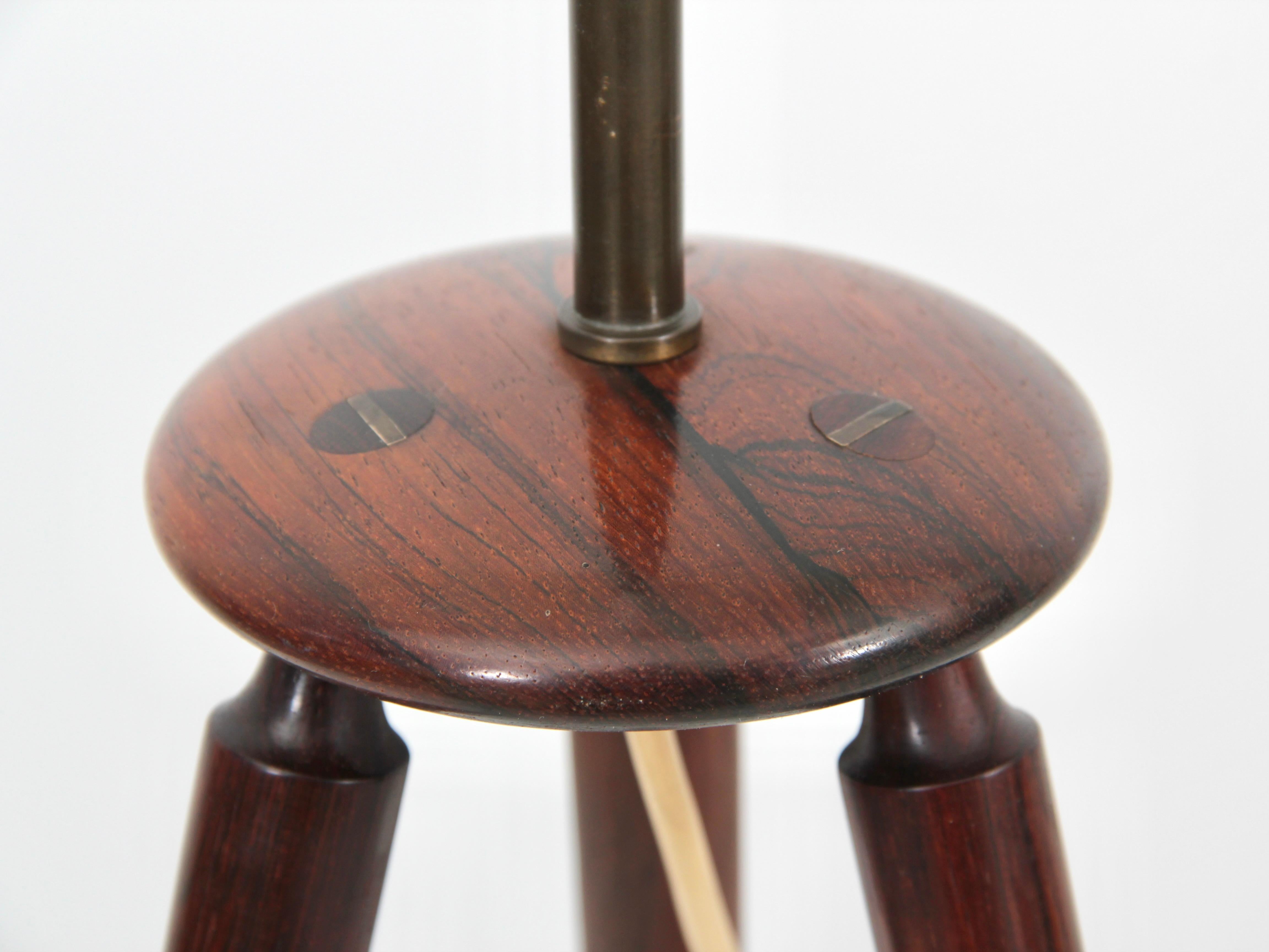 Mid century modern scandinavian pair of tripod table lamps in rosewood. Shades not included. 

