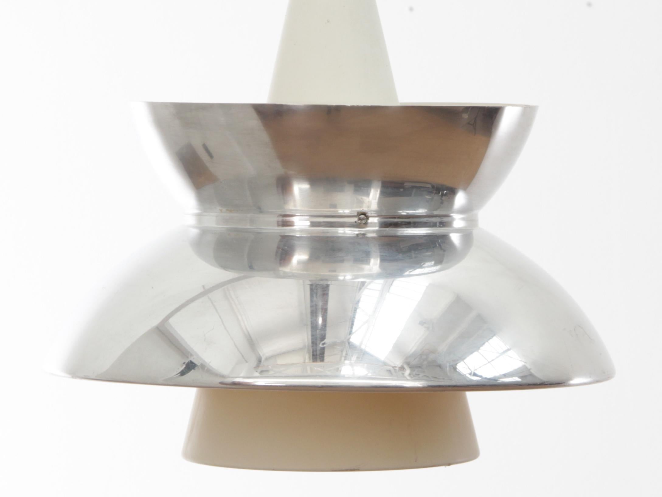 Mid-Century Modern Scandinavian pendant lamp Doo-Wop chrome by Louis Poulsen. Original edition. Originally introduced in the 1950s. Was designed in close cooperation between the Navy Buildings Department and Louis Poulsen. The pendant was used for