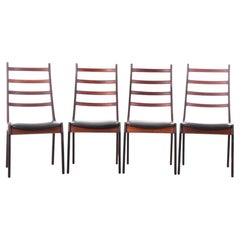 Ensemble de 4 chaises en bois de rose de Henning Kjærnulf, de style scandinave moderne du milieu du siècle dernier.