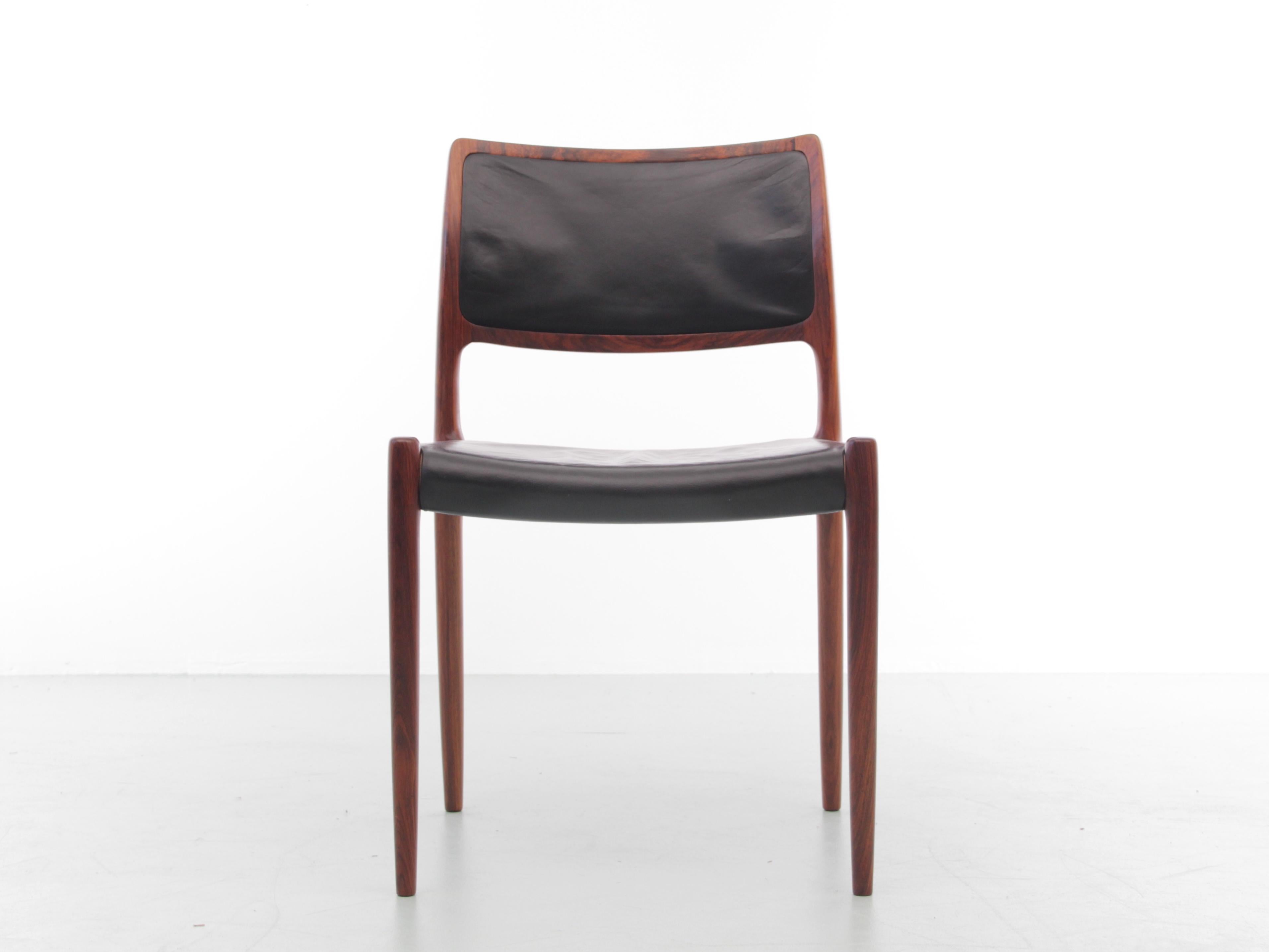 Mid-Century Modern Scandinavian set of 6 chairs in rosewood model n°80 by Niels Møller. Original black leather.