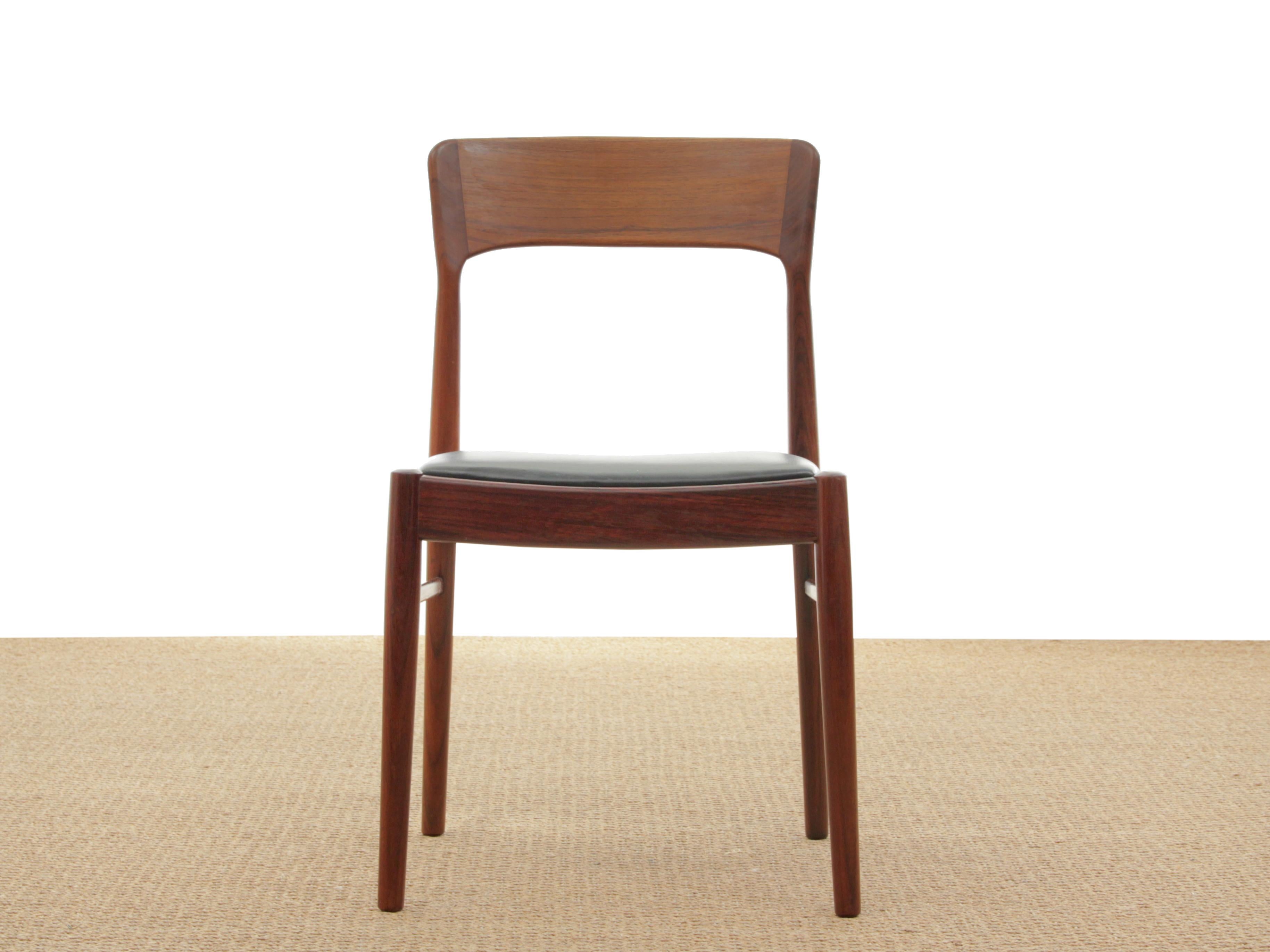 Mid-Century Modern Scandinavian set of 8 rosewood chairs model 26 by Henning Kjærnulf. Seat in original black leather. Referenced by the Design Museum Denmark under the number: RP18470. Media source: Design museum Denmark The Library, I 17695: 11,