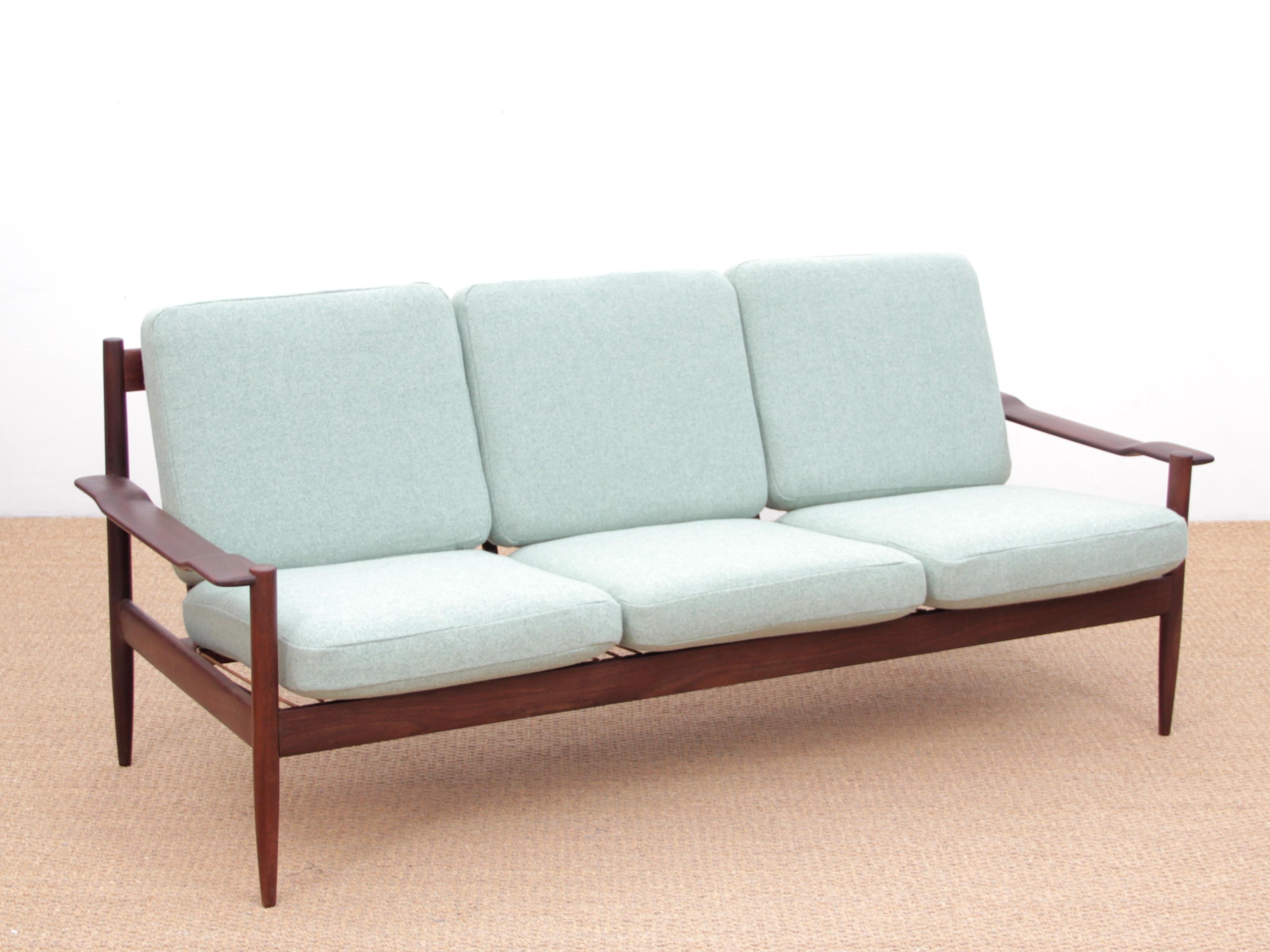 Mid-Century Modern Scandinavian sofa in teak. Seats will be reupholtered with fabric of your choice between Step Melange fabric from Gabriel. Other references of fabric with extra. The price includes the renovation.