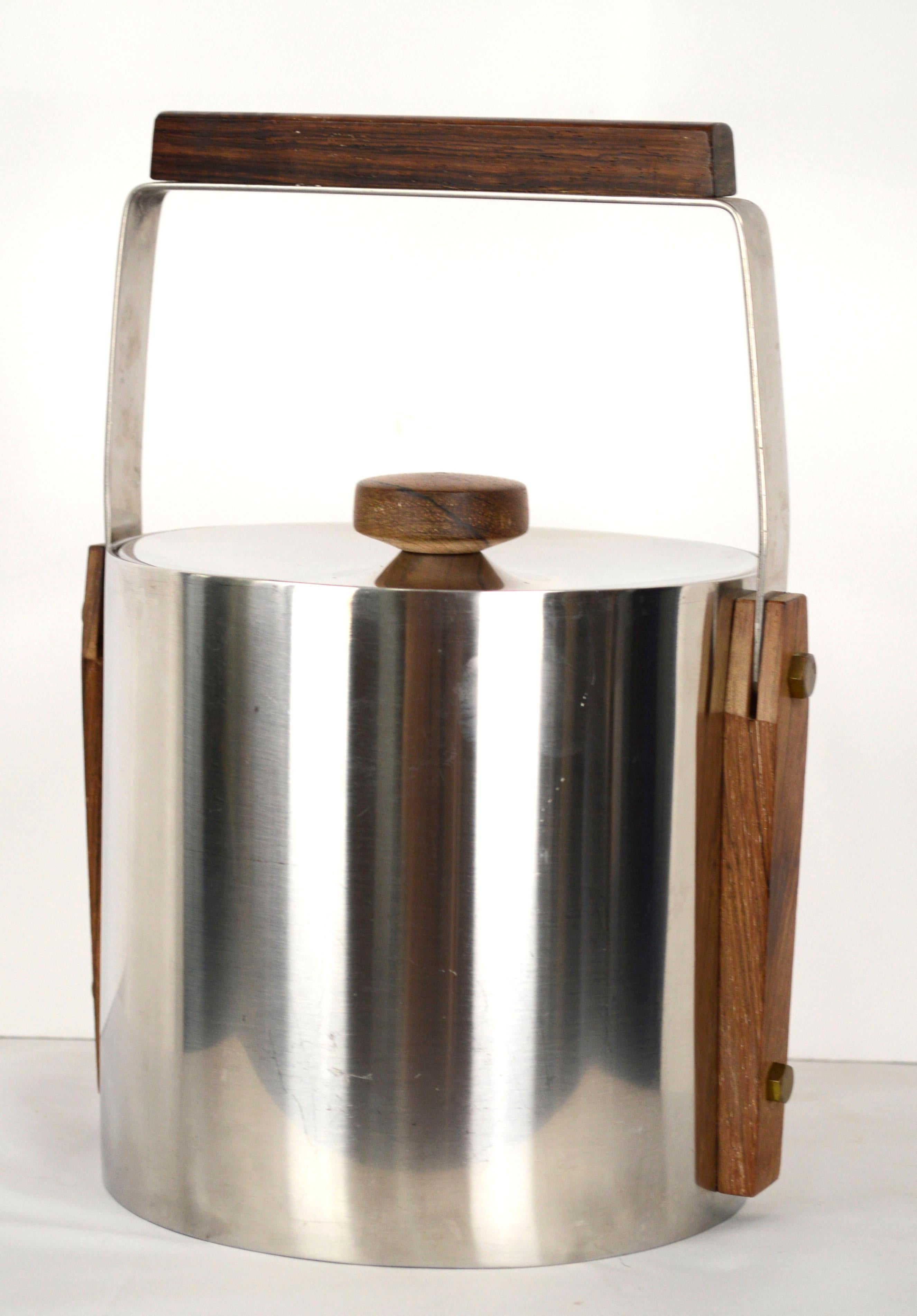 Mid Century Modern Scandinavian Stainless Steel Ice Bucket, Cultura Sweden

Sleek and minimal Mid-Century Modern Scandinavian stainless steel ice bucket, with clean modern lines and beautiful walnut wood handles and details, by Cultura Sweden.
