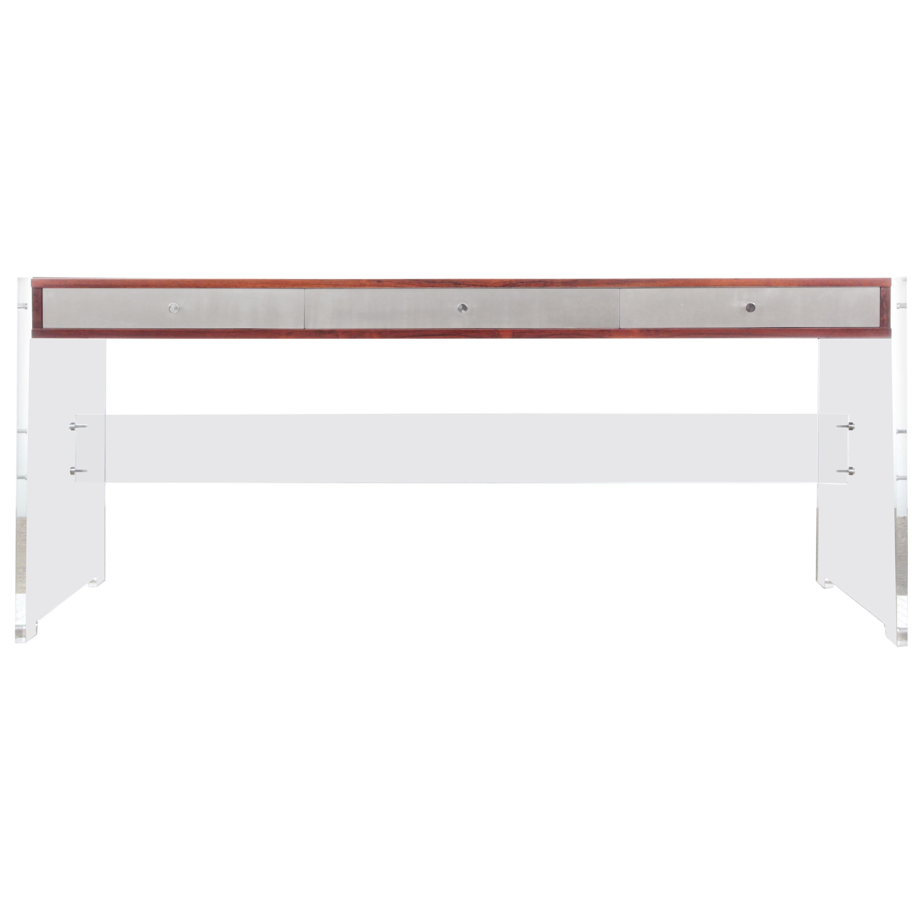 Rosewood desk with plexiglass structure. The desk has 3 drawers with aluminum fronts and chromed steel handles. Thanks to its acrylic structure, top seems to float. Good condition, light color difference with a desk set. Design by Poul Nørreklit in