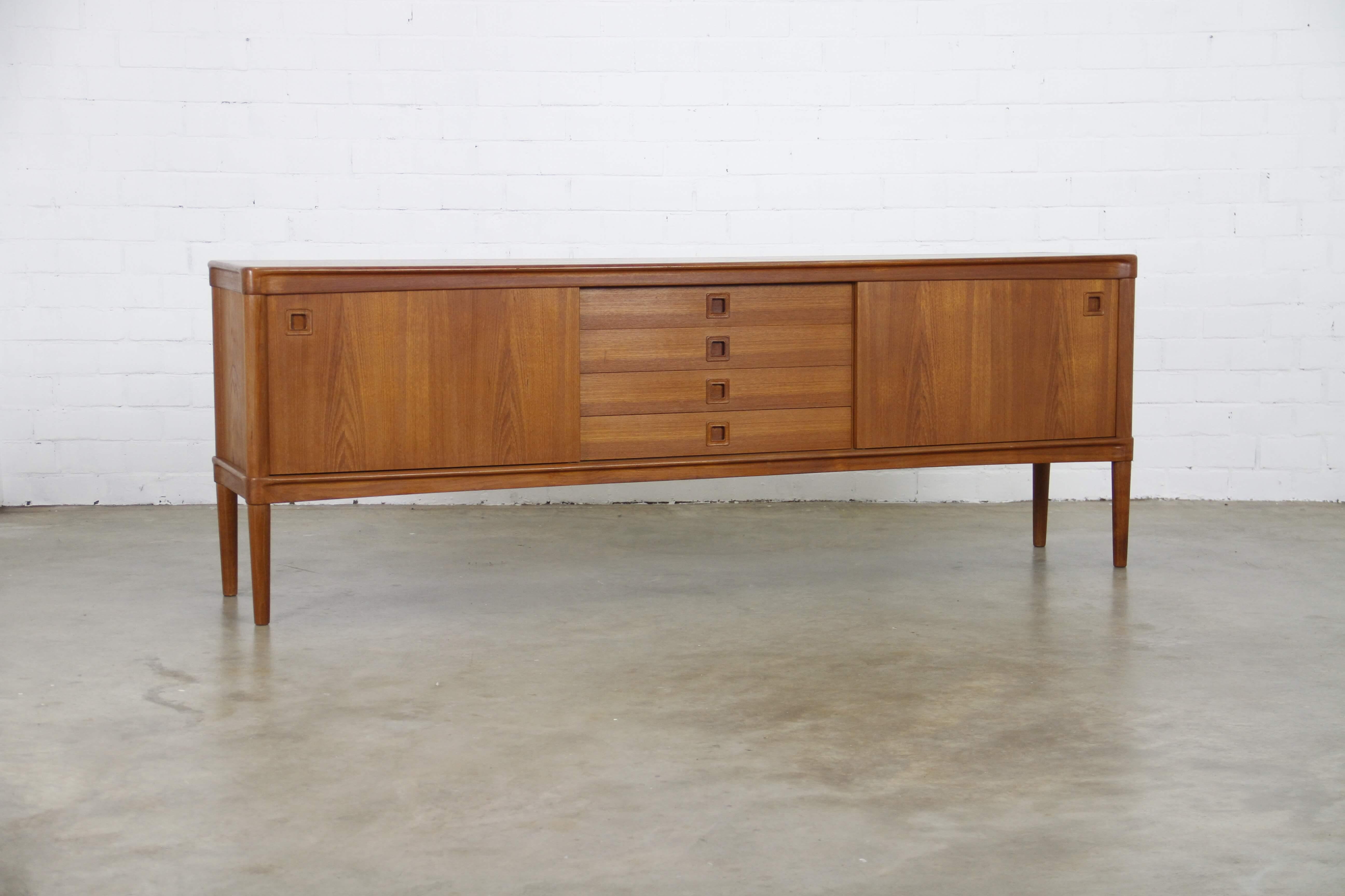 This sideboard was designed by Henry W Klein for Bramin, Denmark in the 1960s.
There are two sliding doors, four drawers and shelves.
The sideboard is of very high quality and in very good condition.
Finished in teak.